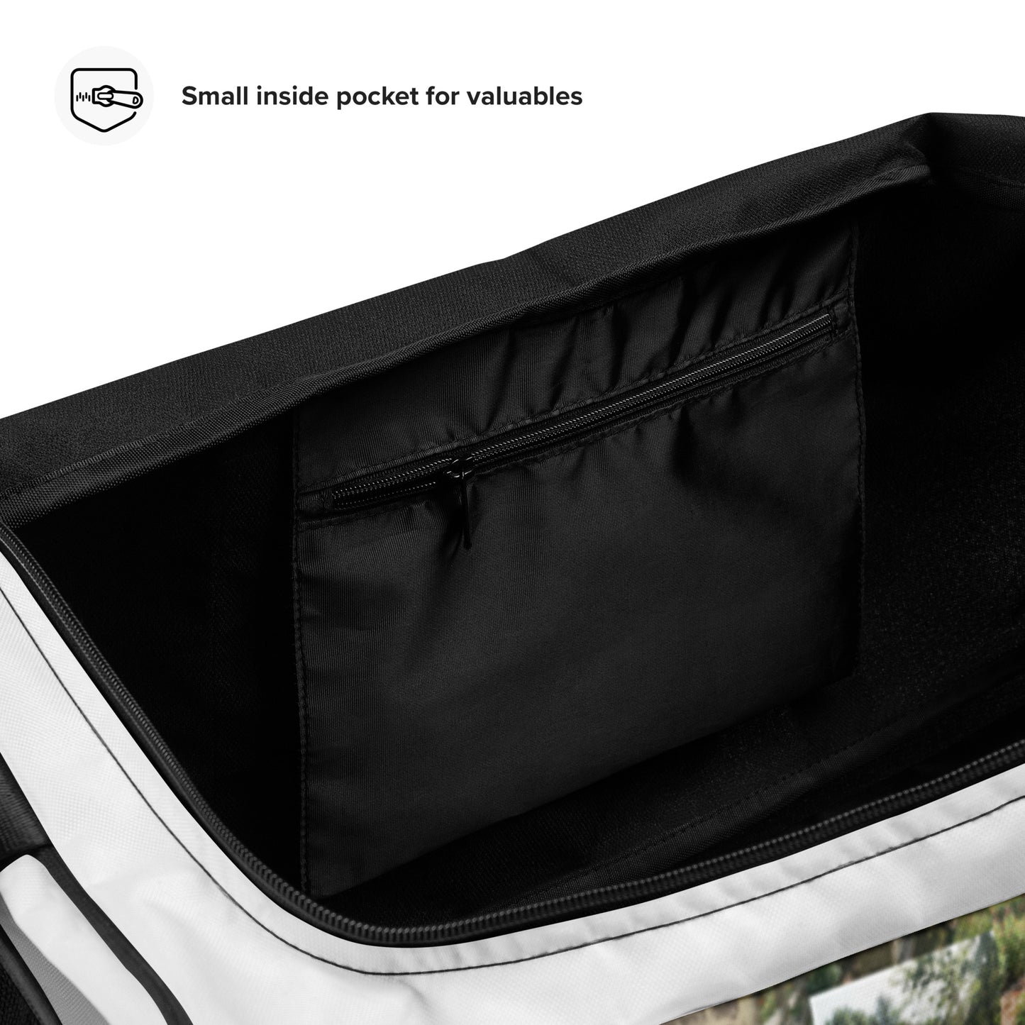 Black-lined interior compartment with zipper in a white duffle bag