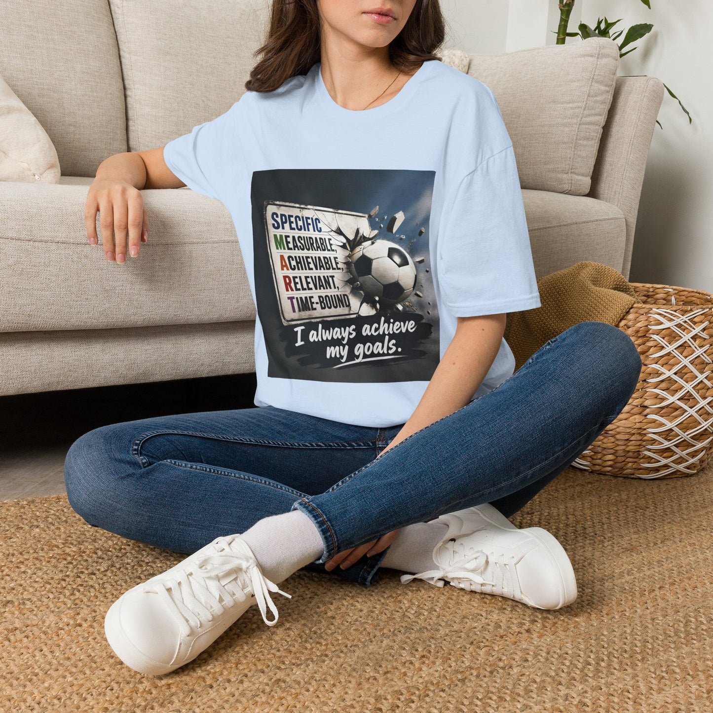 Unisex light blue T-shirt with soccer ball graphic and 'I always achieve my goals' slogan
