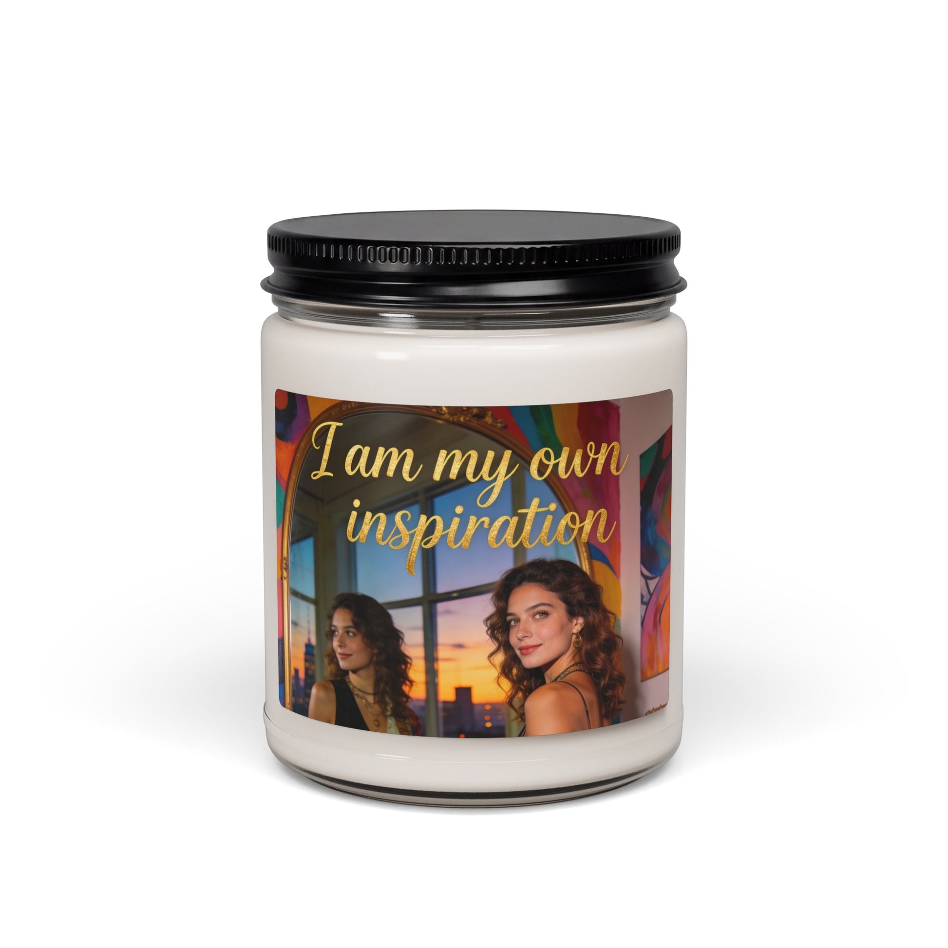 Scented soy candle in clear glass jar with black lid, printed 'I am my own inspiration' label
