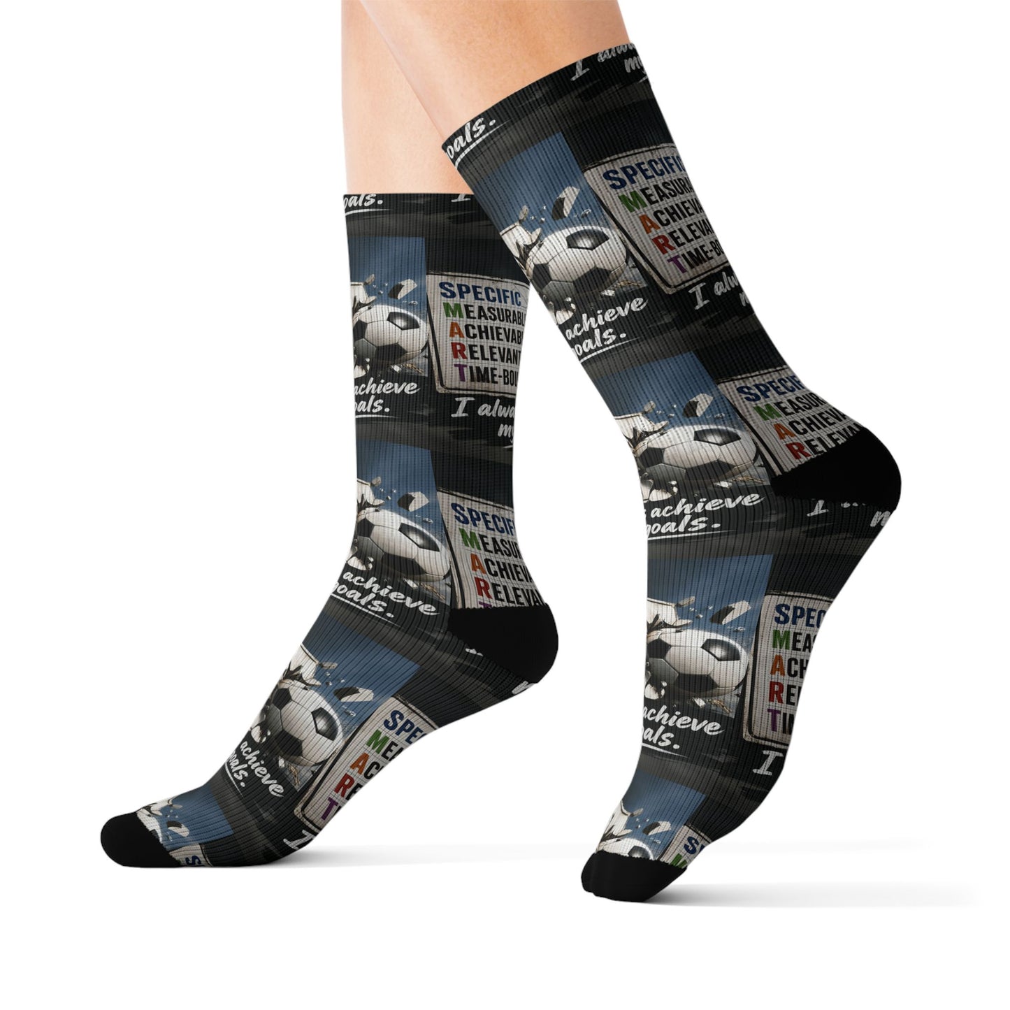 Black crew socks with an all-over print of soccer balls and colorful "SMART Goals" text on a blue background.