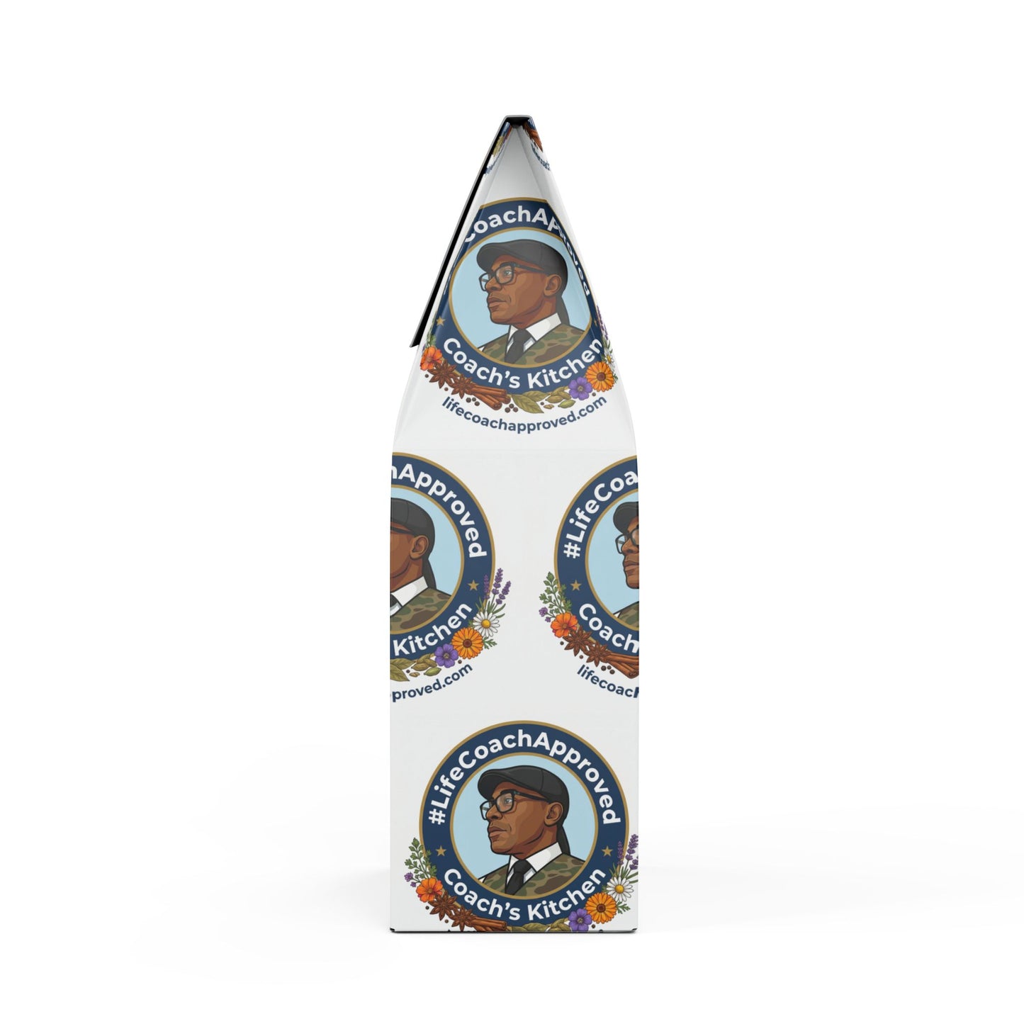 Coffee blend bag, angled side view, with Coach's Kitchen badge, portrait, and floral graphics