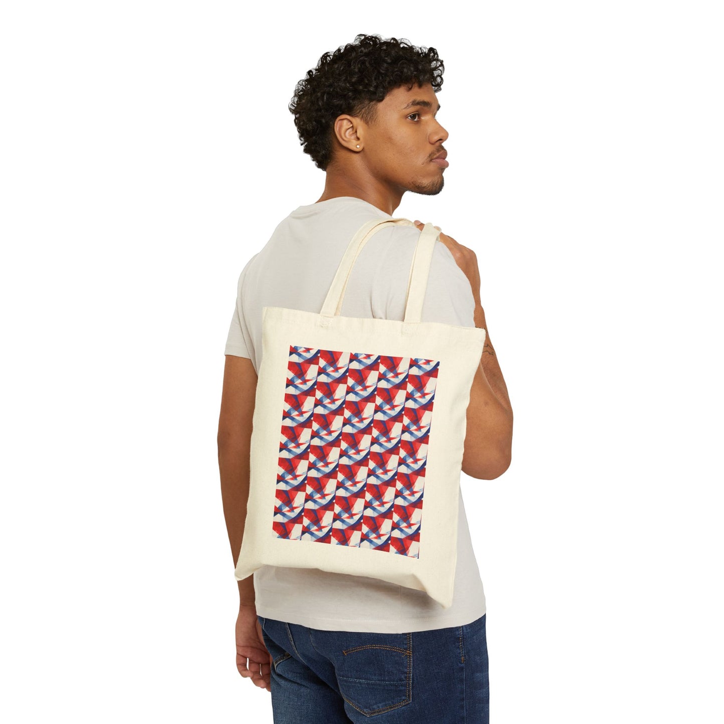Natural canvas tote bag on model with red, white, and blue geometric patriotic front panel.
