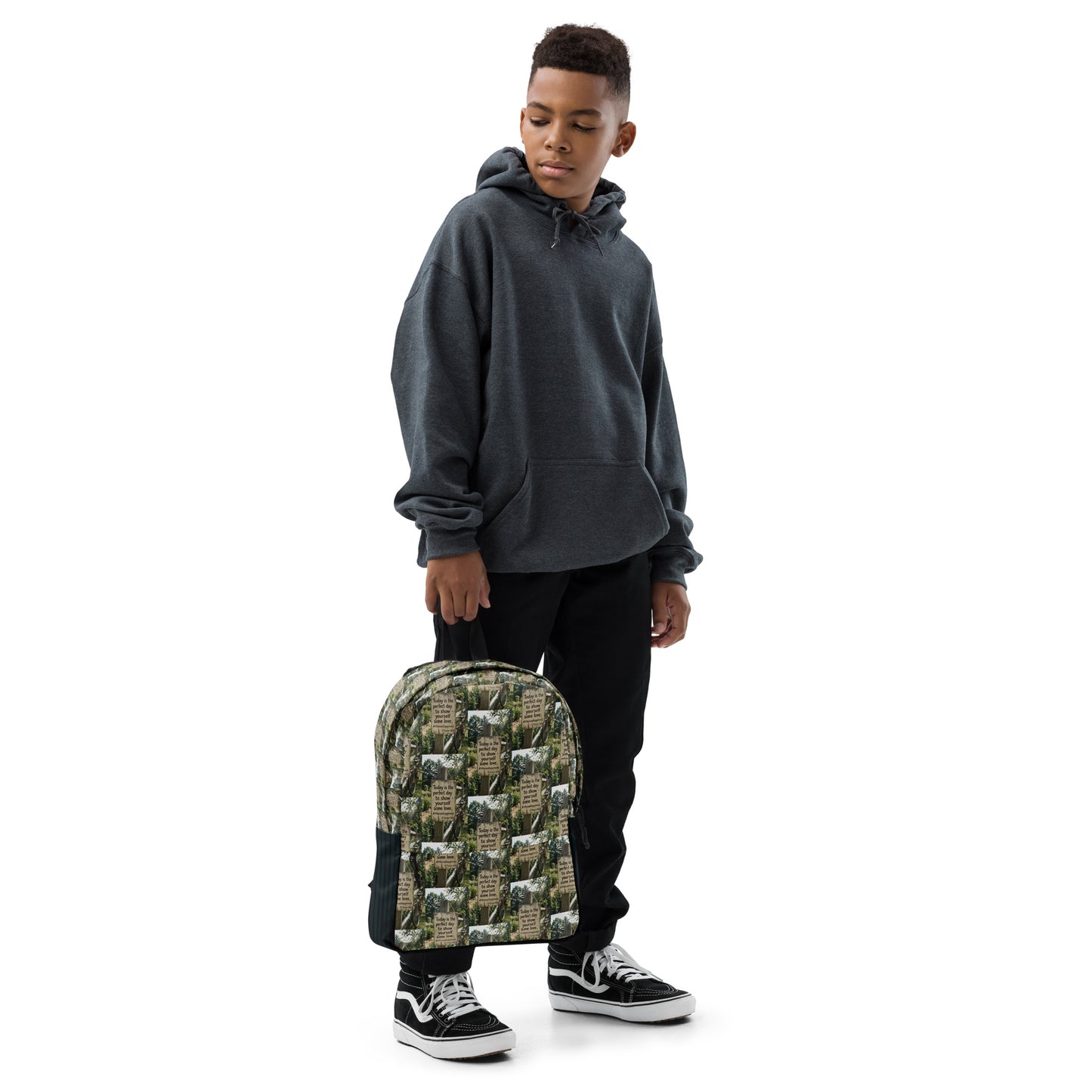 Green quote-pattern backpack with black side panels, front pocket, and adjustable straps.