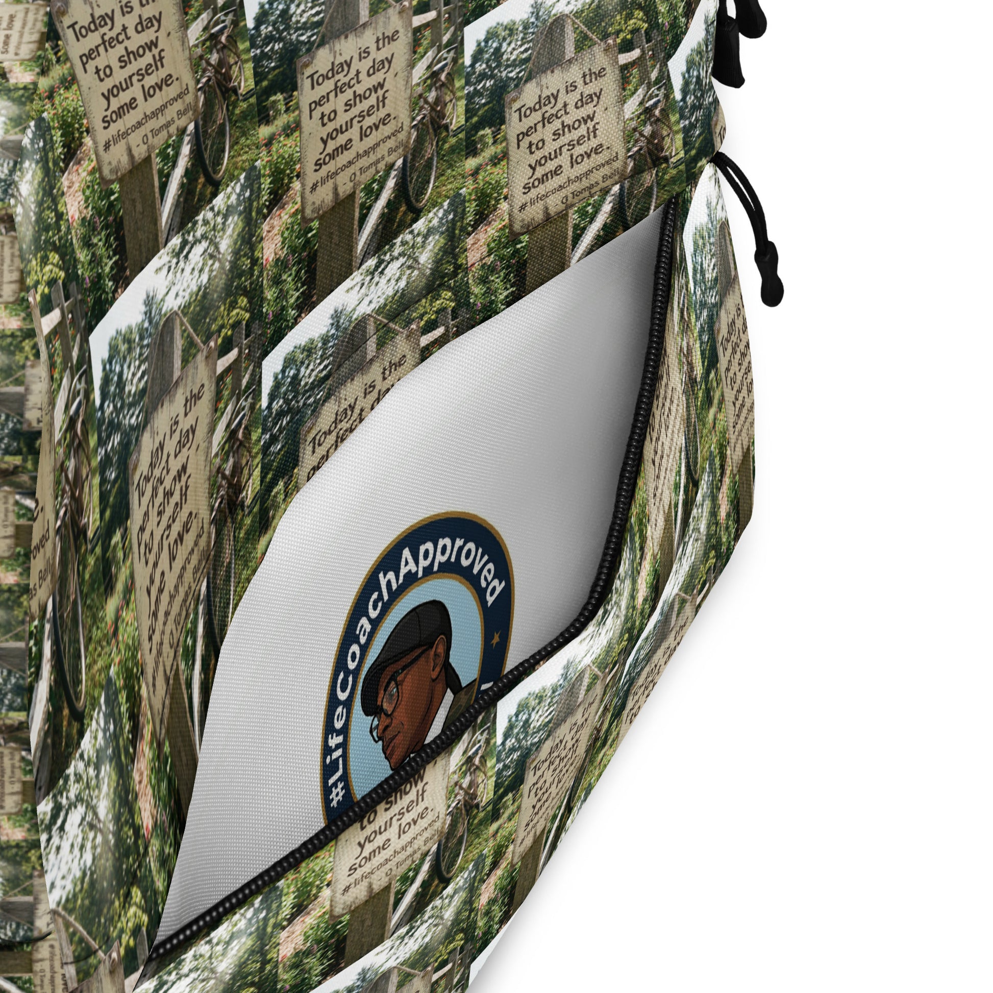 Printed backpack fabric with illustrated logo patch on the front pocket panel