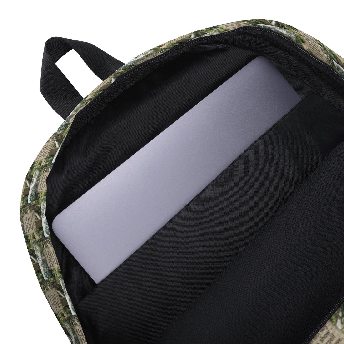 Self love backpack with open zipper, showing black interior and gray padded laptop sleeve