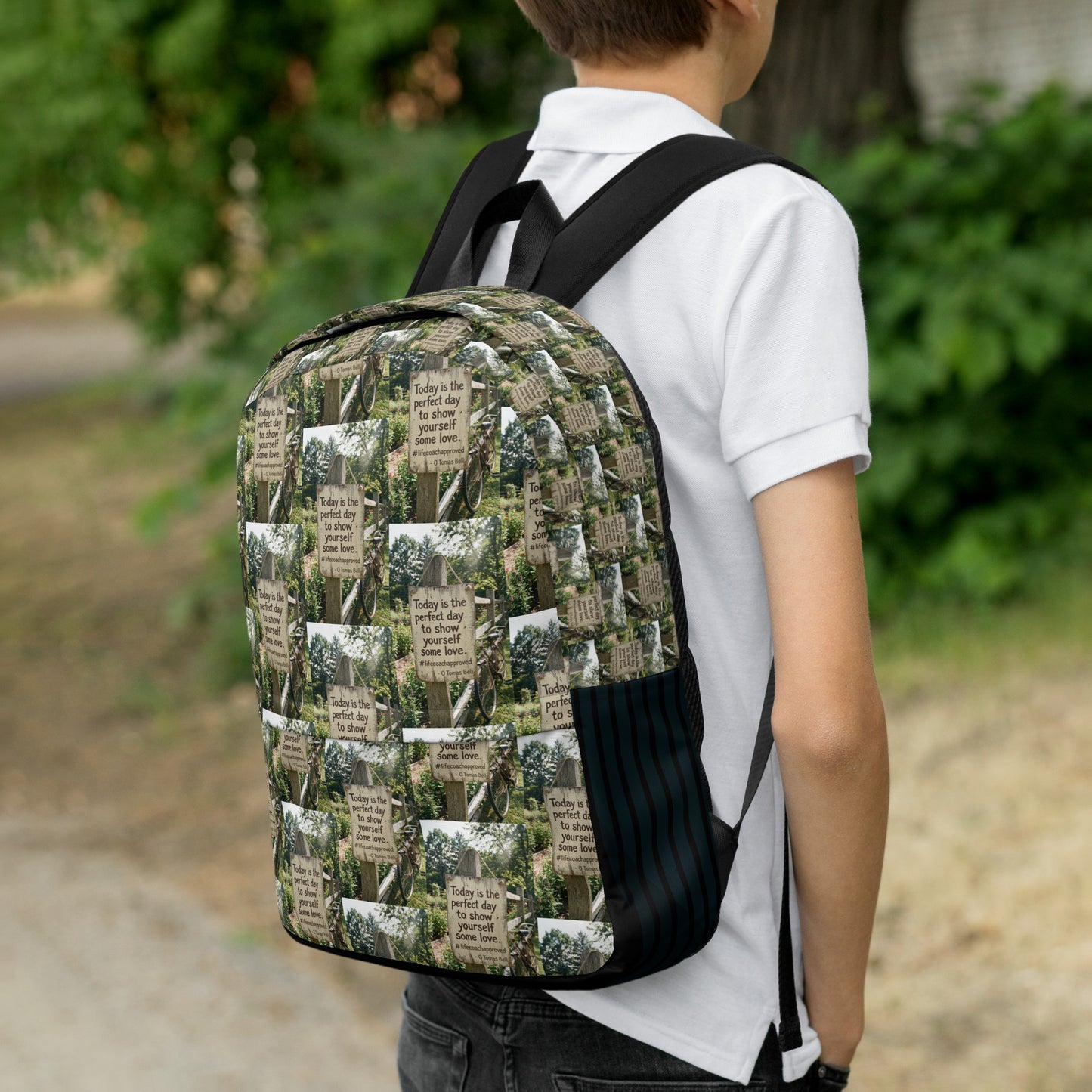 Printed canvas backpack on a child, front view with black straps and lower pocket