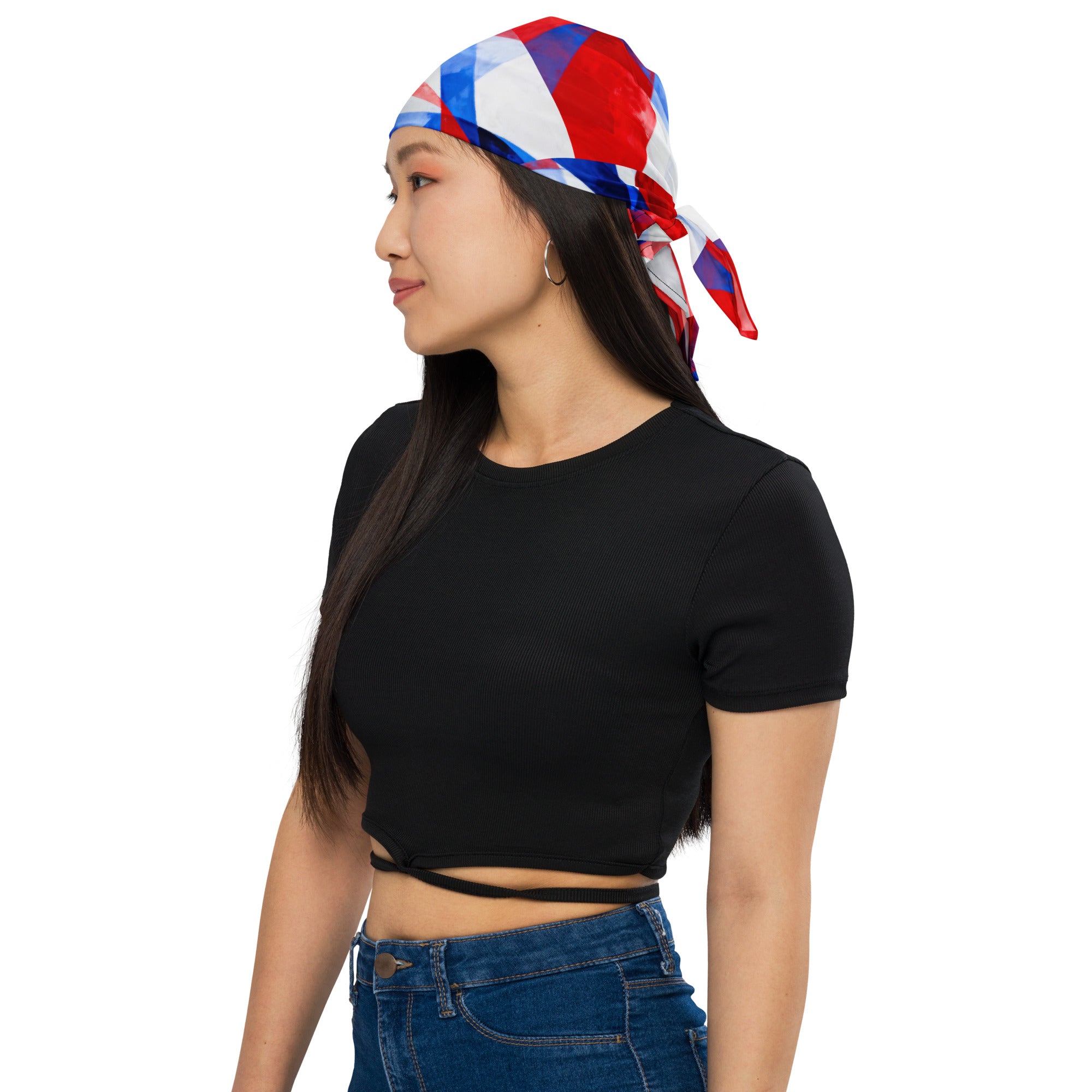 Red, white, and blue geometric bandana tied on head, worn over long dark hair