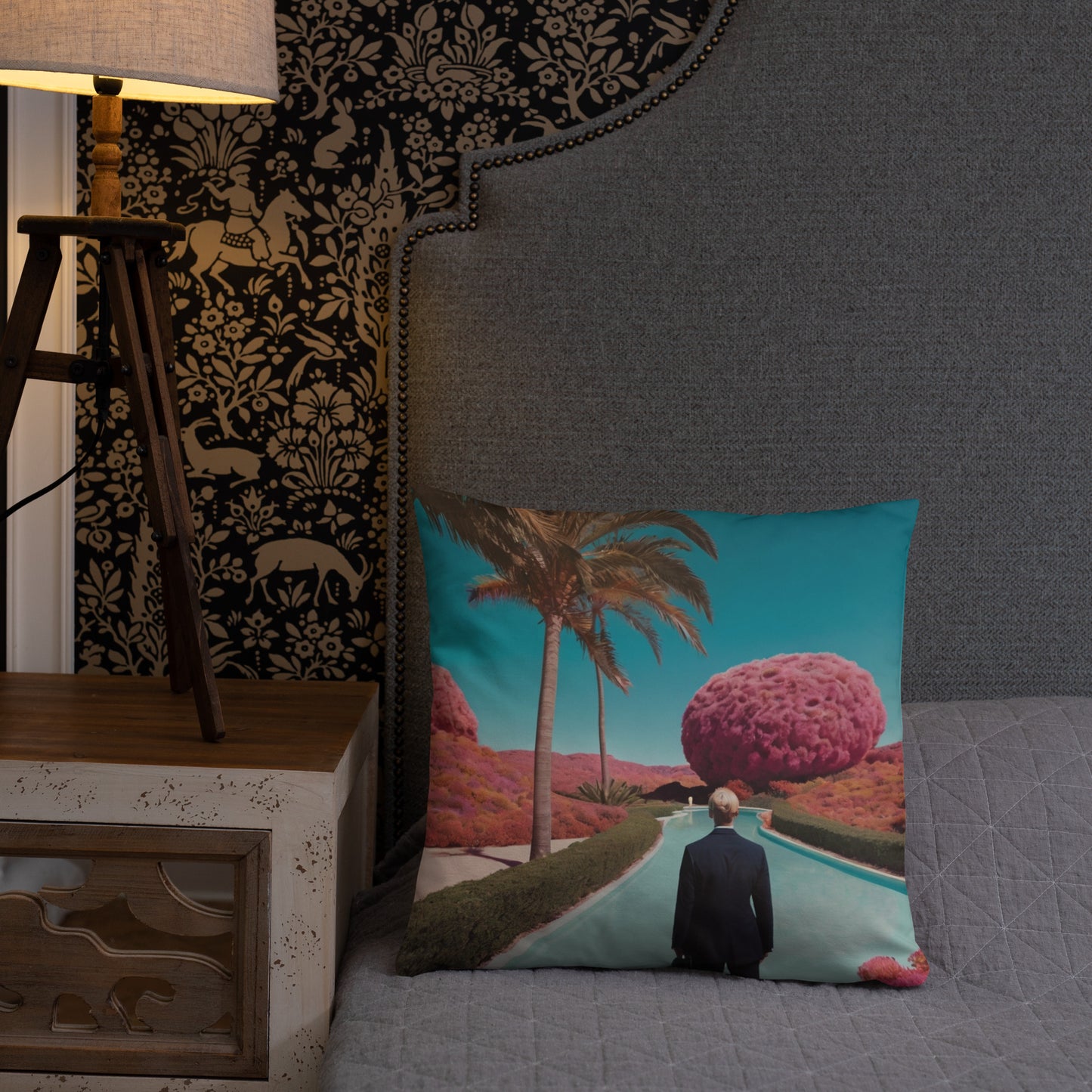 Turquoise accent pillow cover with palm-lined path and man from behind beside pink tree