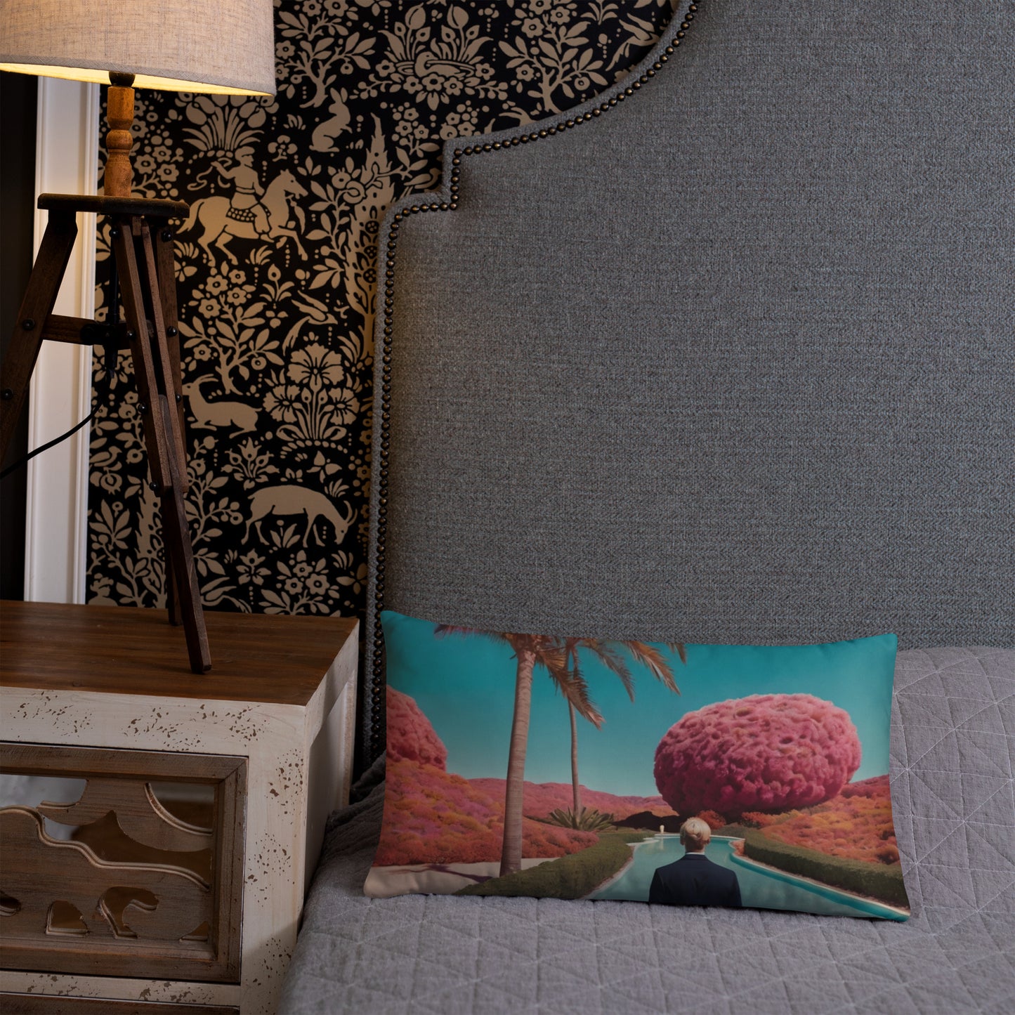 Rectangular accent pillow with teal scene print, pink tree, palm silhouettes, and figure