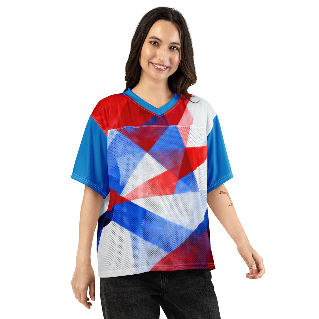 Boxy football jersey worn by model; red, white, and blue geometric print; V-neck; short sleeves