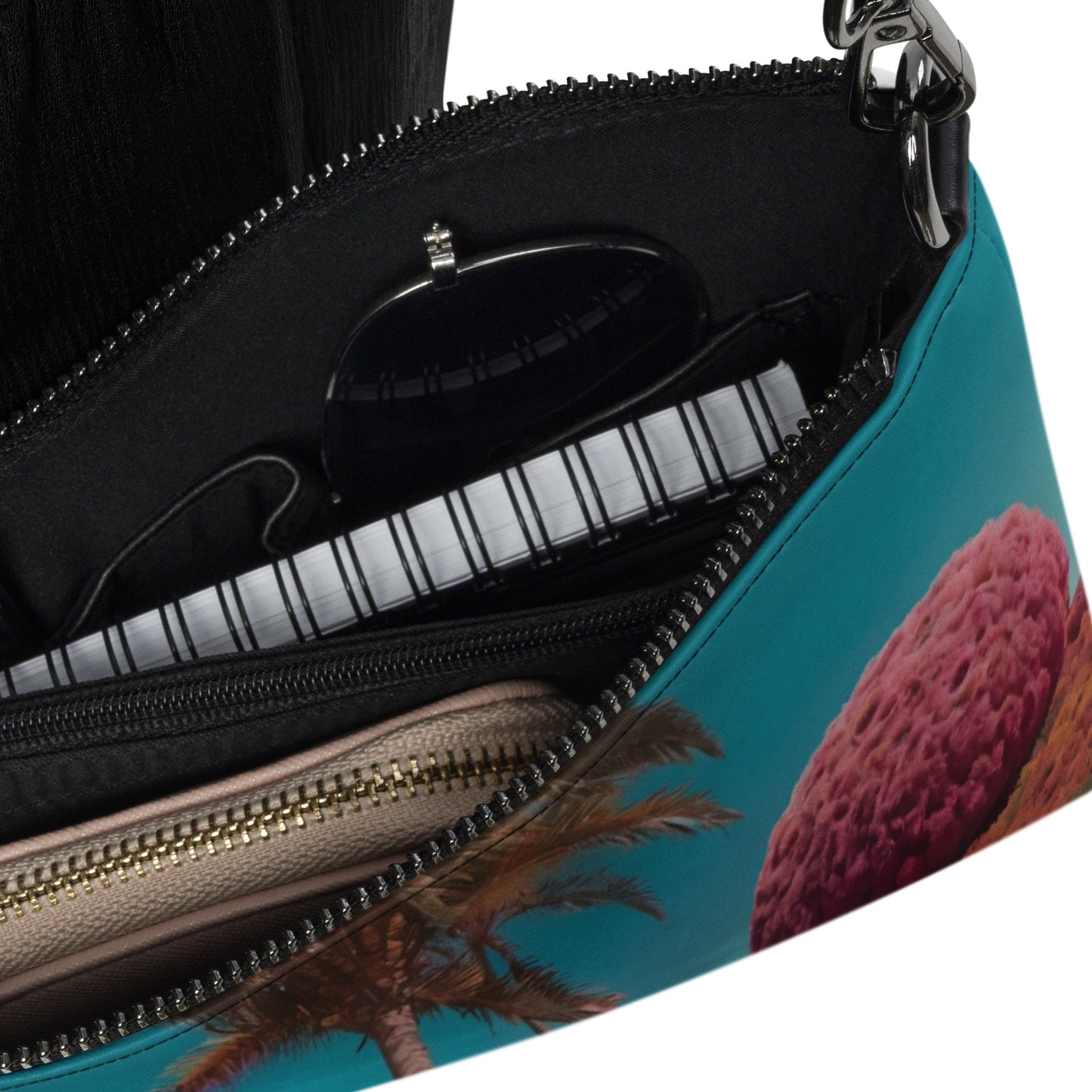 Unisex crossbody bag interior close-up with black lining and dual zippers.