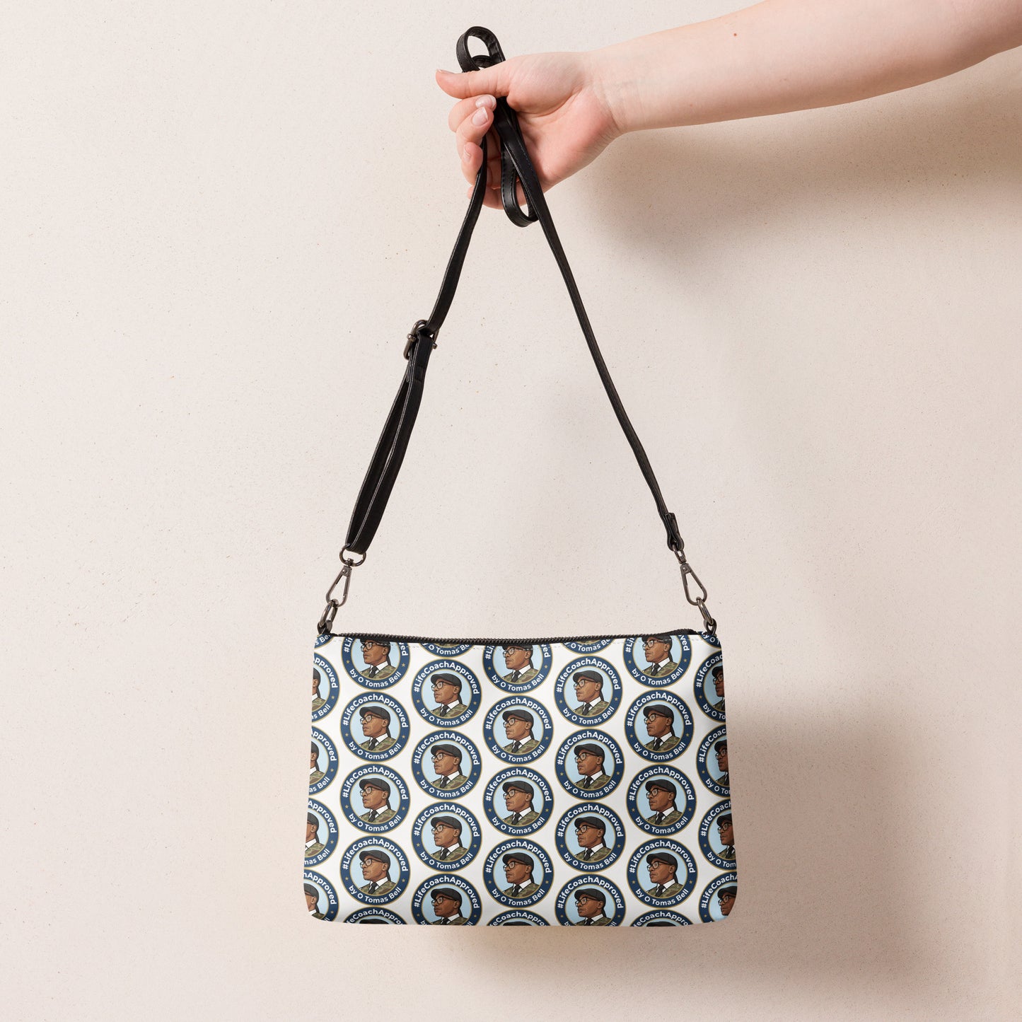 Pattern crossbody bag with long black strap and zip top, circular portrait print