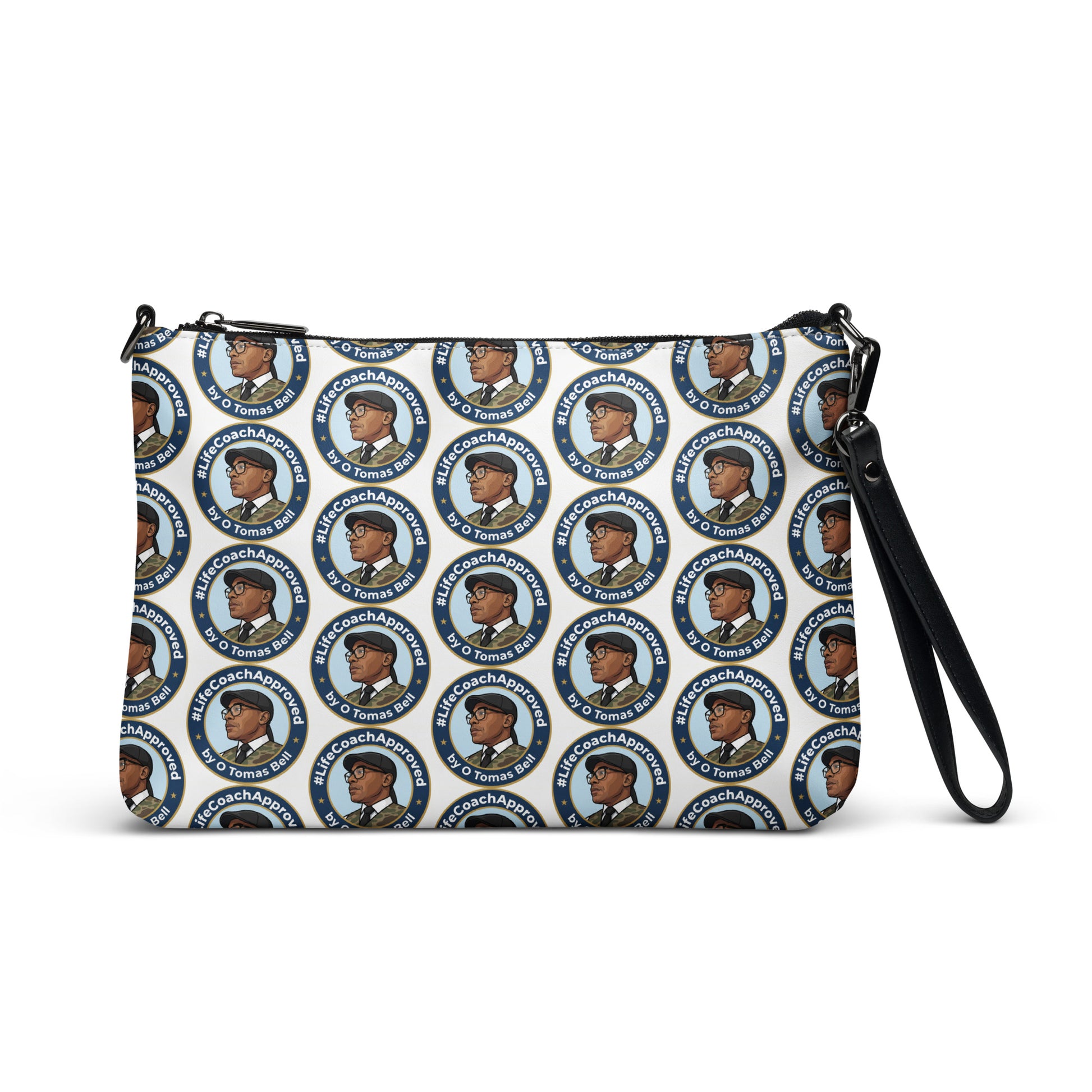 Printed crossbody bag with black wrist strap and zipper top, side view with blue circular pattern