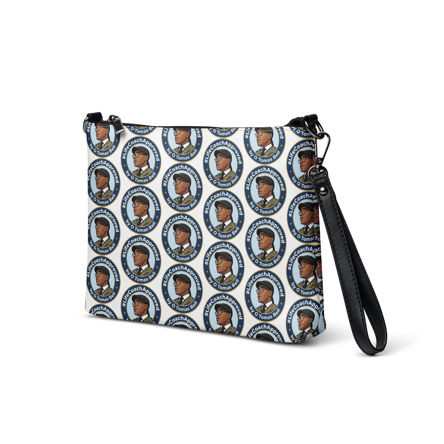 Printed crossbody bag with black strap and zipper top, front corner view of blue circular pattern