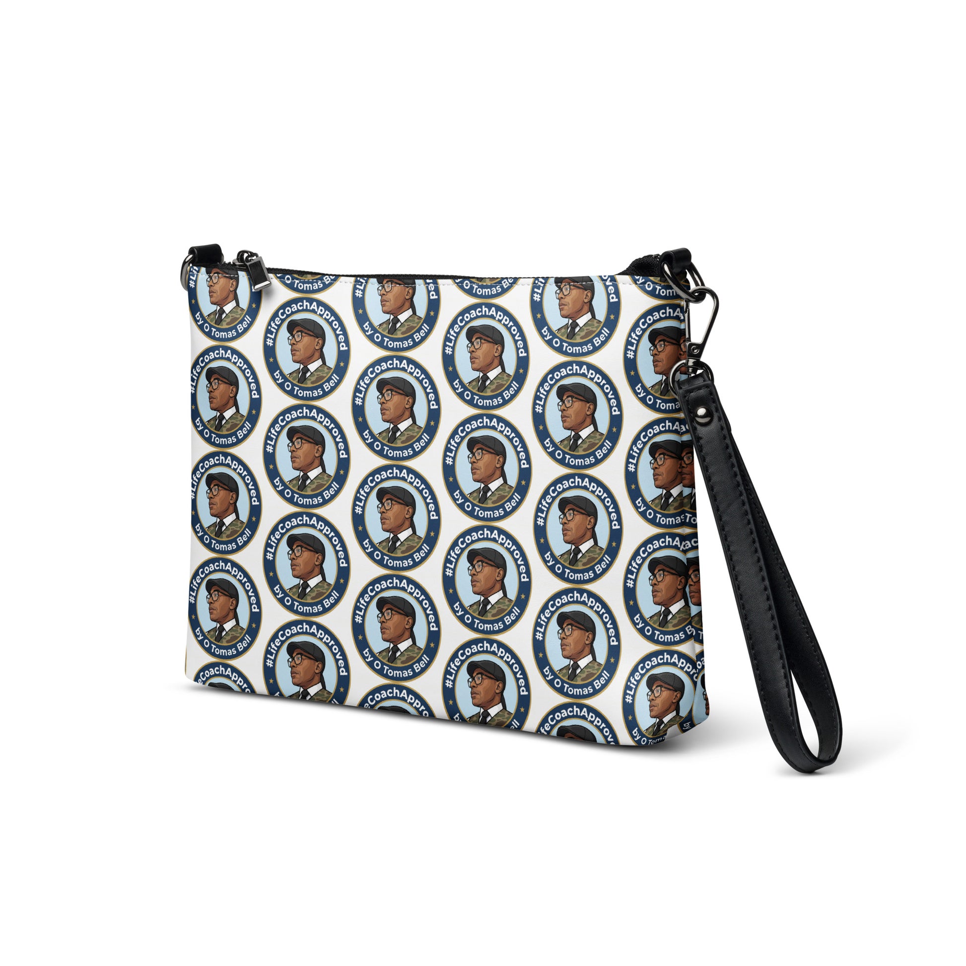 Printed crossbody bag with black strap and zipper top, front corner view of blue circular pattern