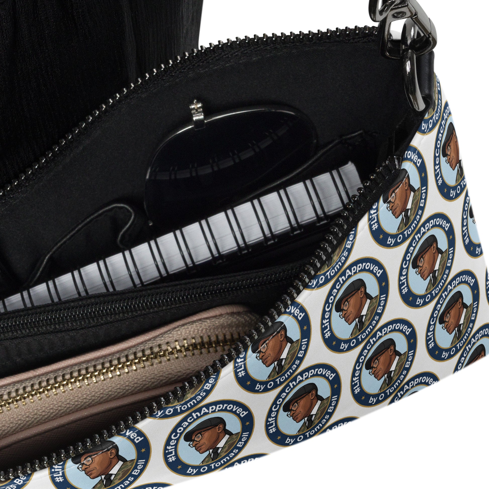 Crossbody bag interior with black lining, open zip, circular portrait print