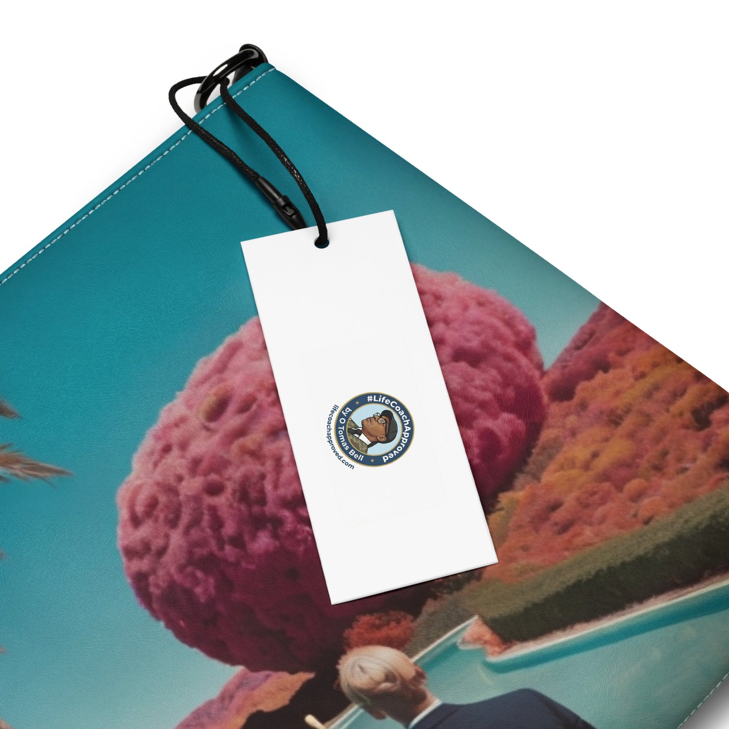 Unisex crossbody bag with teal scenic print and white hang tag on black loop.