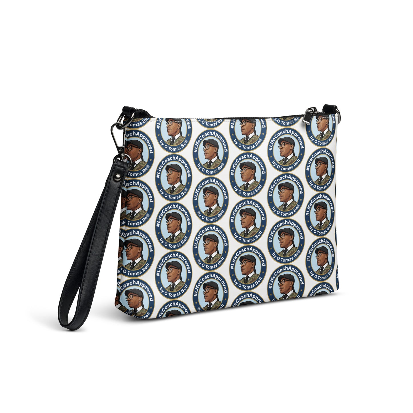 Printed crossbody bag with black handles and zipper top, angled view of blue circular pattern