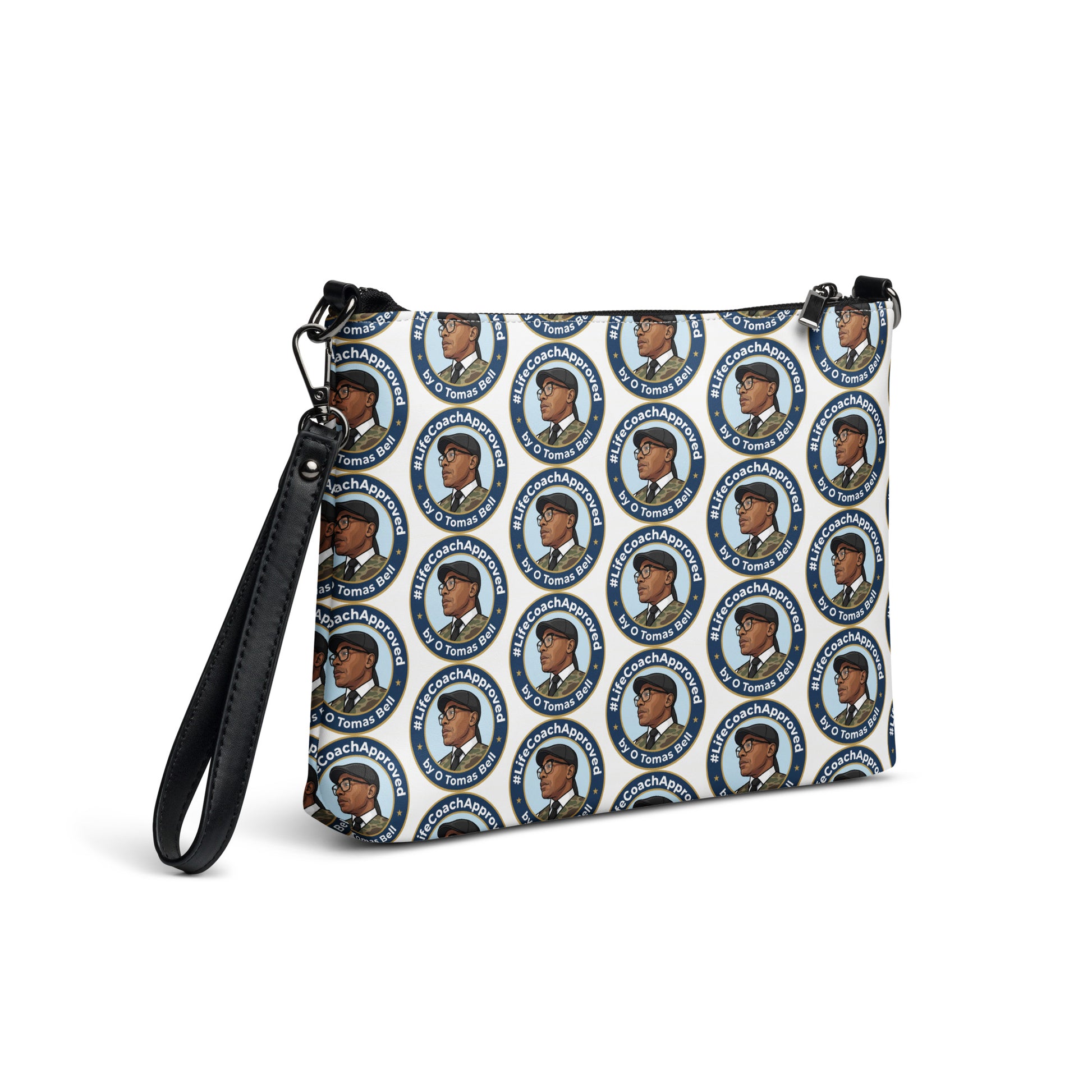 Printed crossbody bag with black handles and zipper top, angled view of blue circular pattern