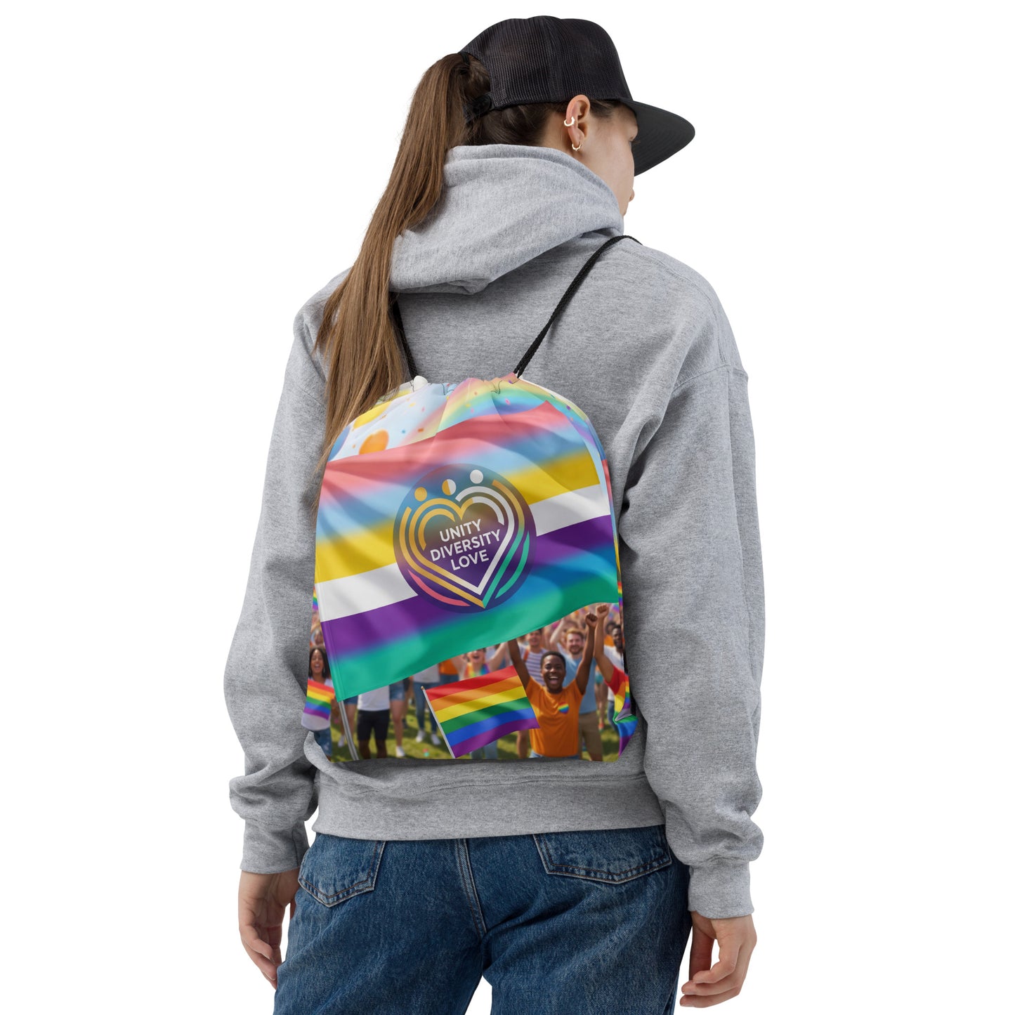 Drawstring bag with rainbow stripes, heart graphic, and black drawstring cords