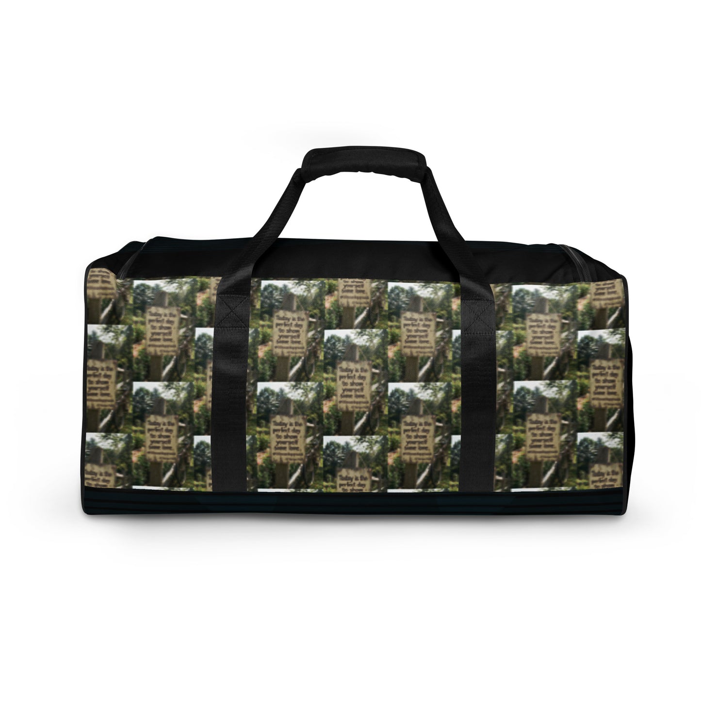 Black duffle bag with green tree collage and black handles