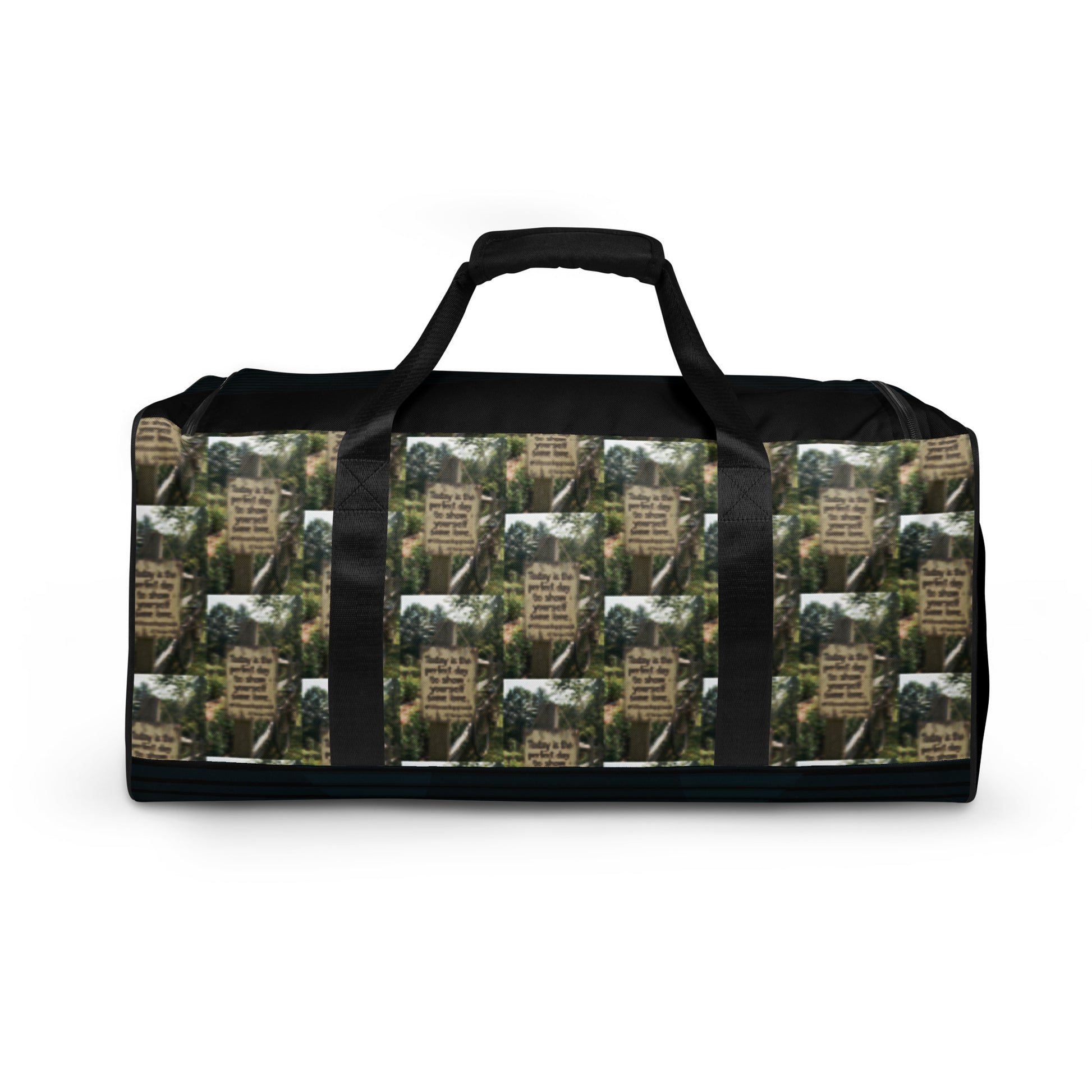 Black duffle bag with green tree collage and black handles