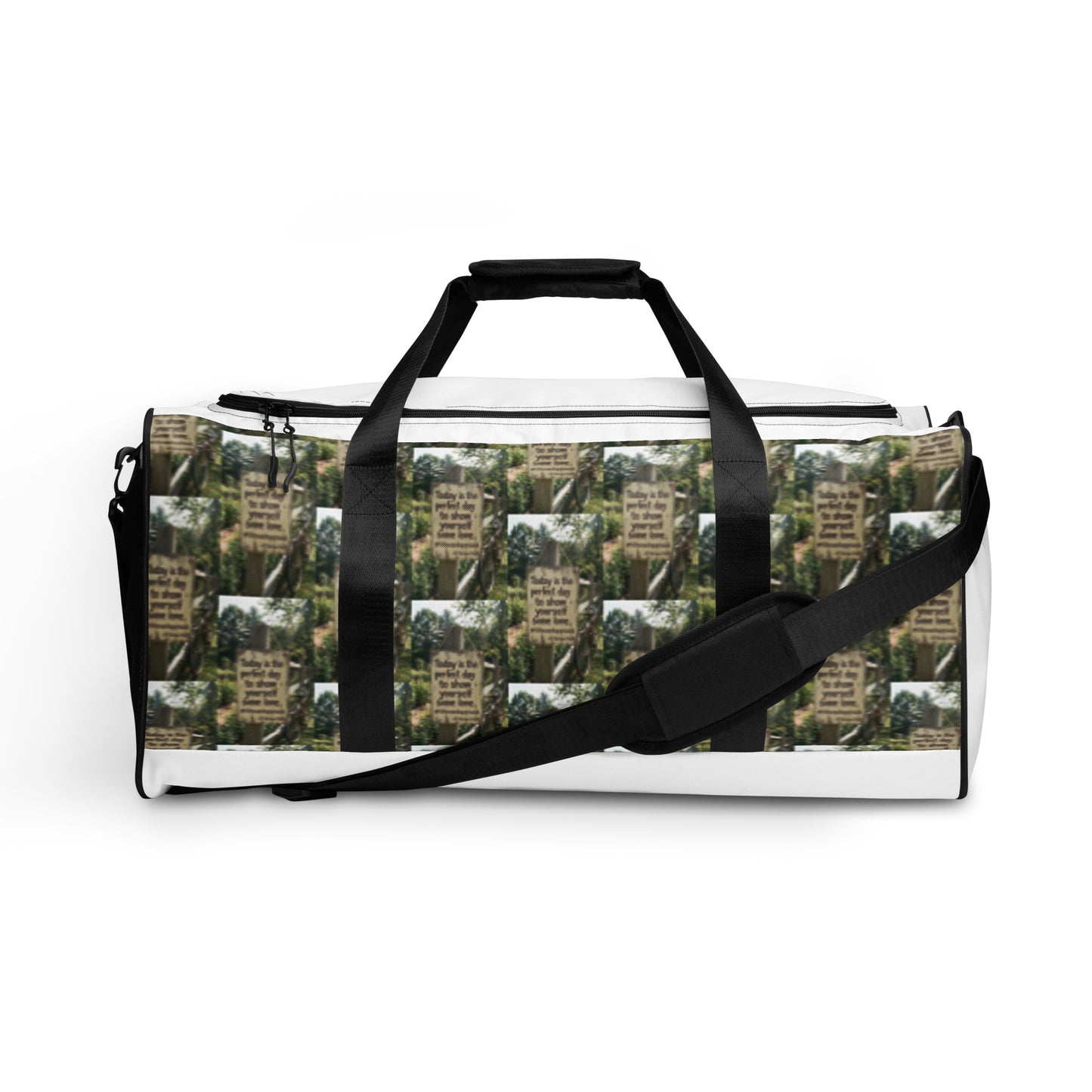 Duffle bag with adjustable shoulder strap; white trim and green tree-text pattern fabric.