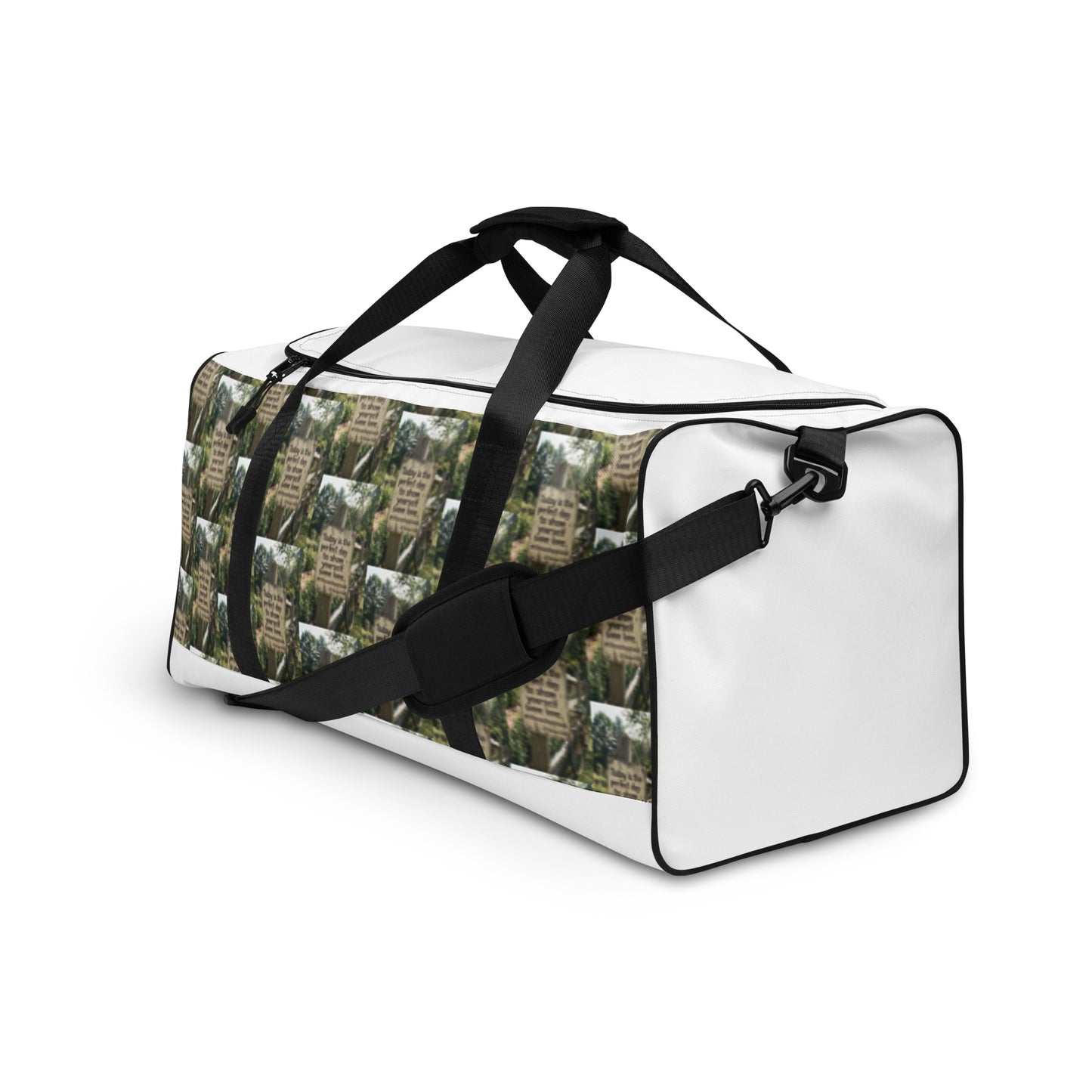 Duffle bag with crossbody strap and black buckle; green tree-text pattern with white end panel.