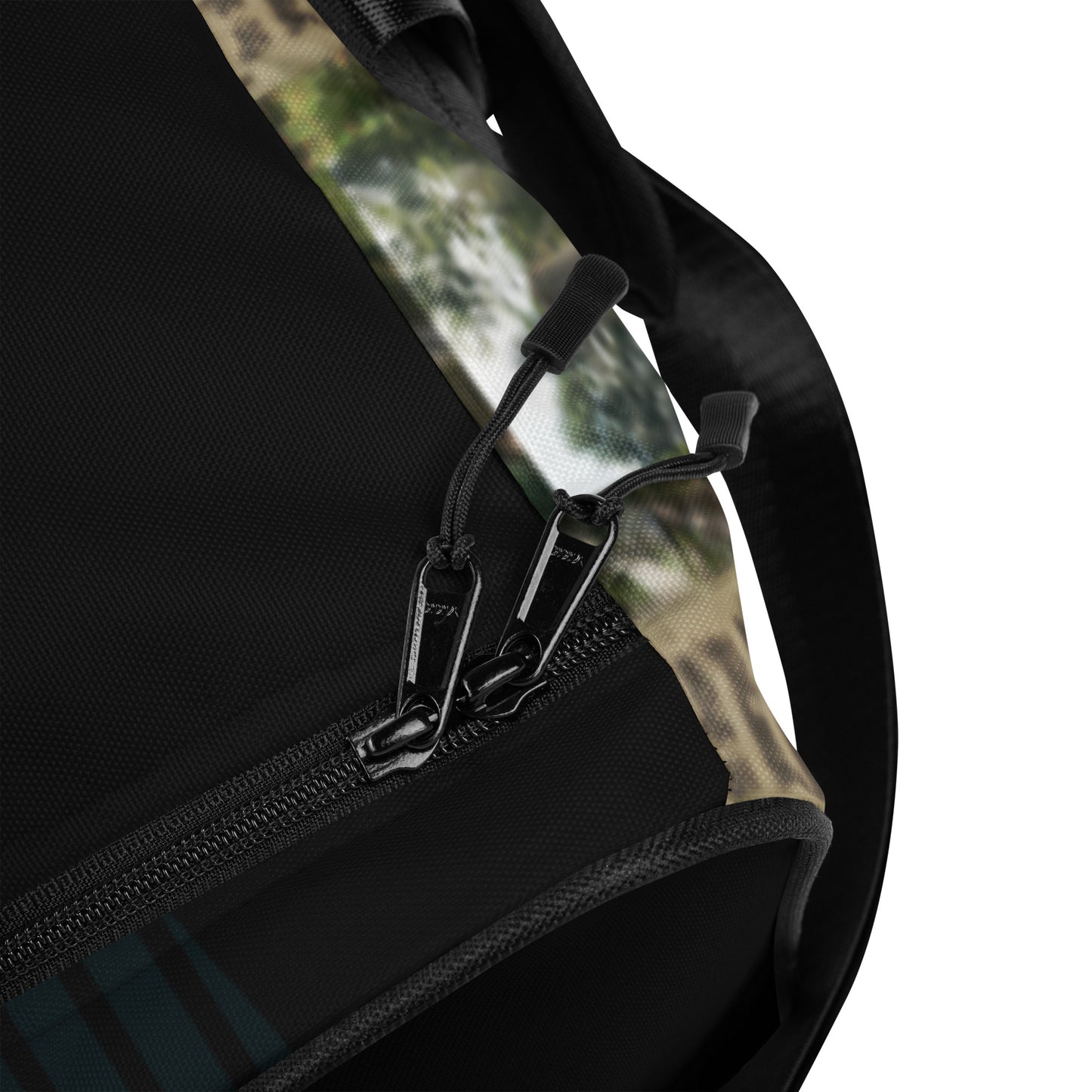 Black duffle bag corner detail with zipper track and metal clip on the strap.