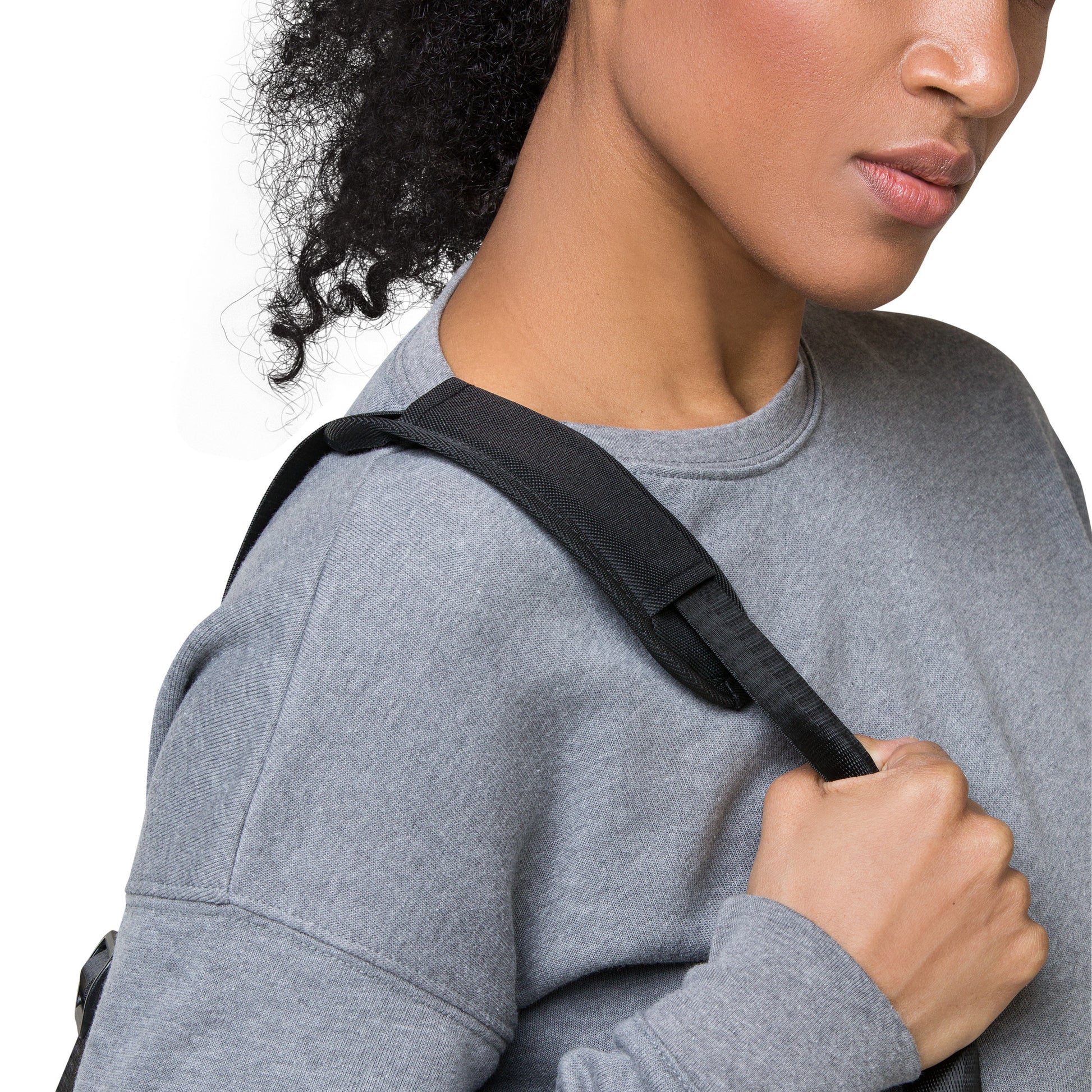 Self-love duffle bag on shoulder, black strap and top carry handle