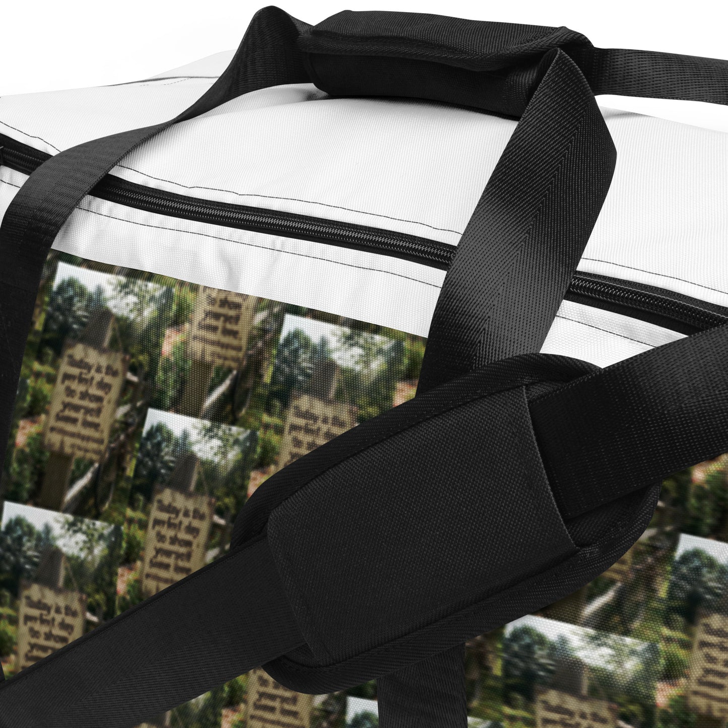 Duffle bag top with black strap and black zip closure over white fabric front panel