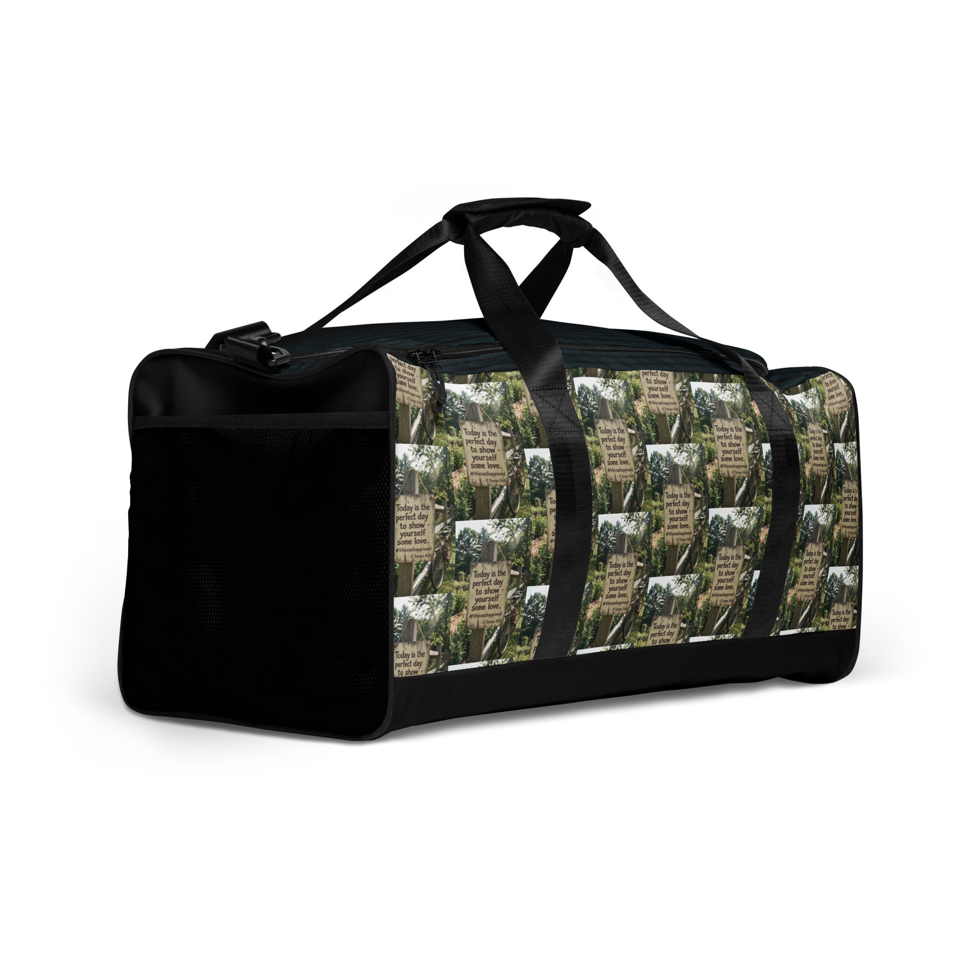 Black duffle bag with green collage side, end zipper compartment, and handle