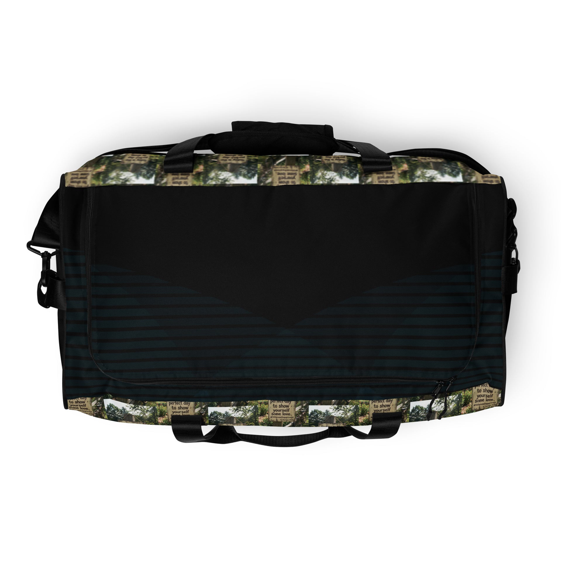 Black duffle bag with green collage exterior and front zip pocket area