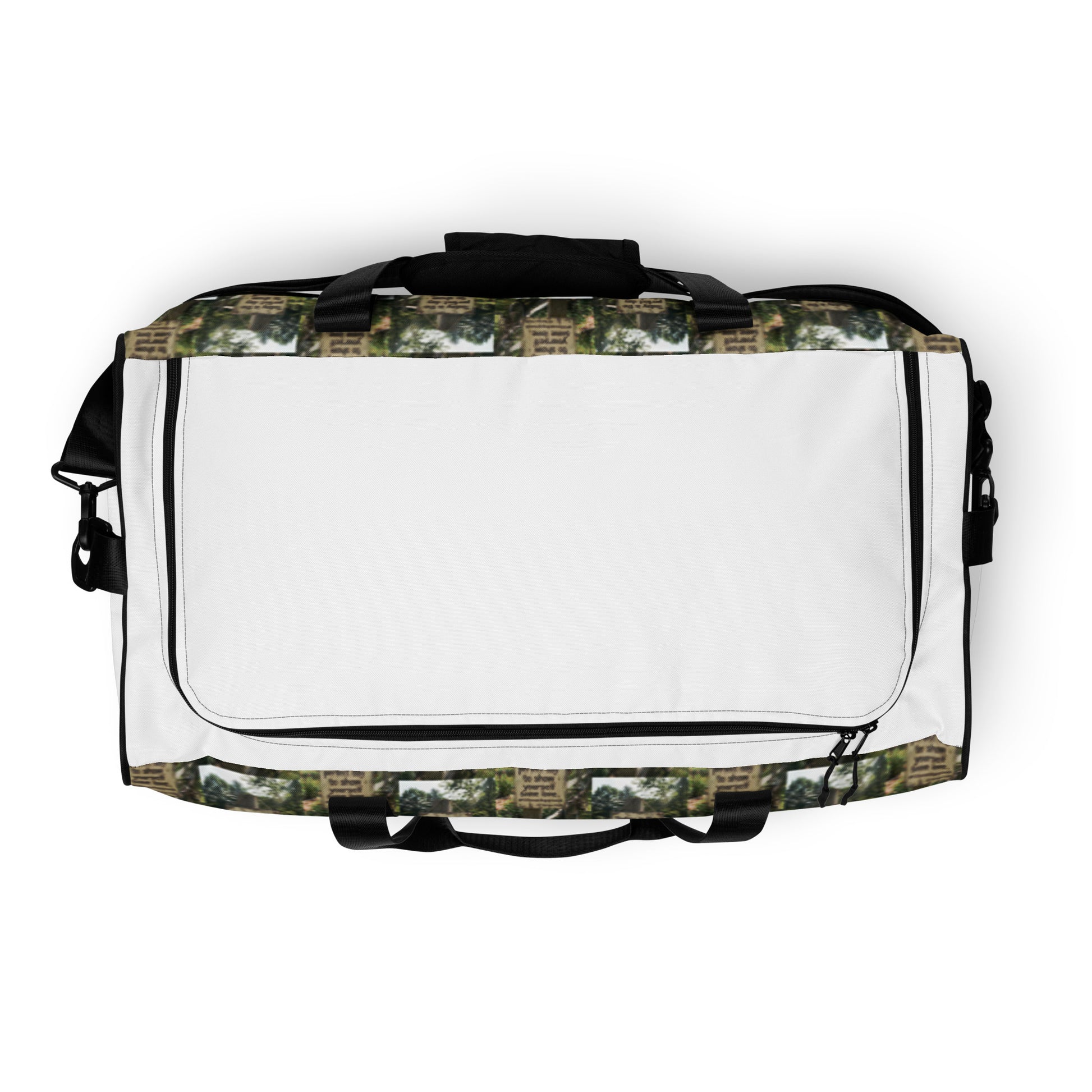 Duffle bag back view with white flap and black zipper; patterned sides and top handle.