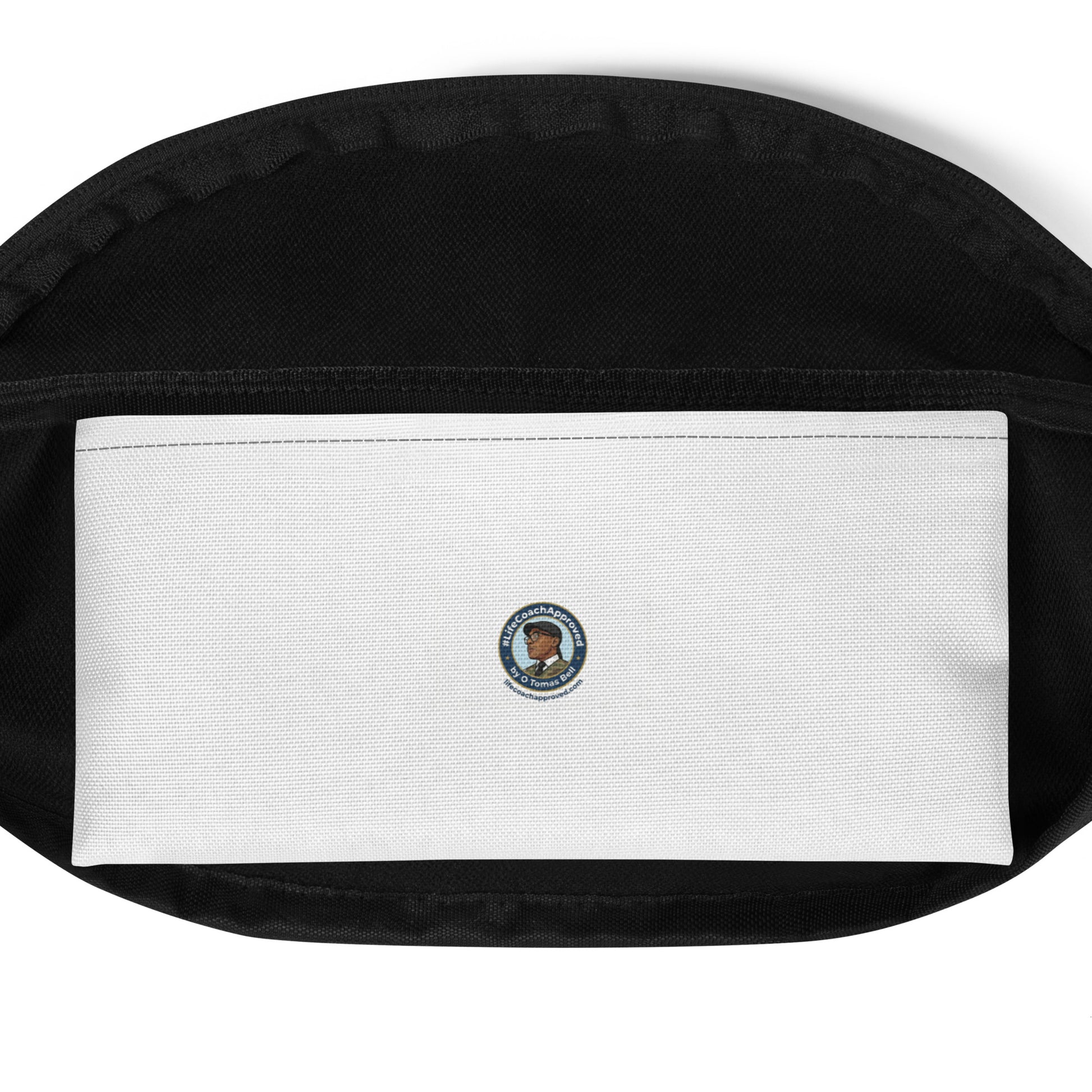 Black fanny pack with white label patch and small circular emblem on back.