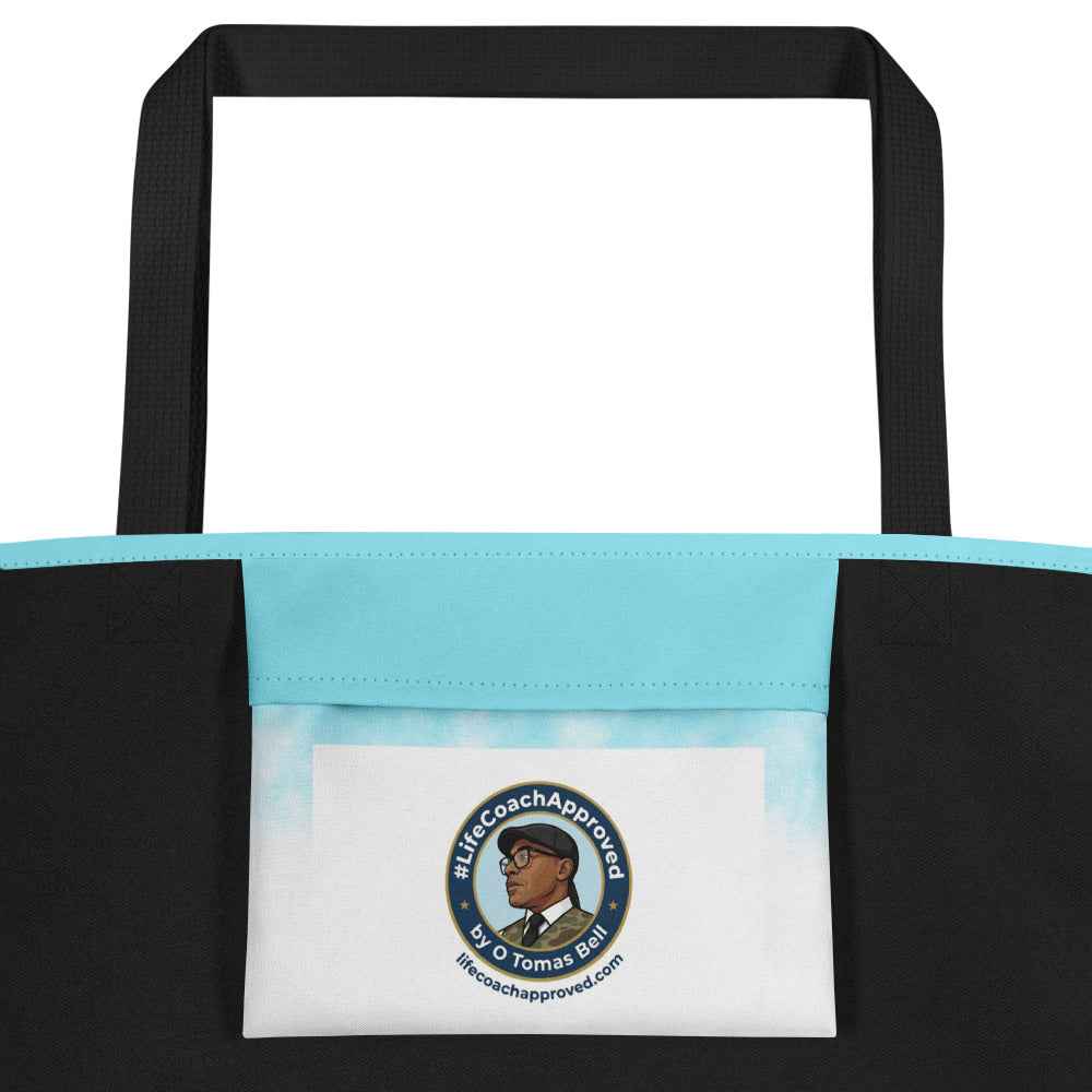 Light blue beach tote bag with black handles and front logo label pocket