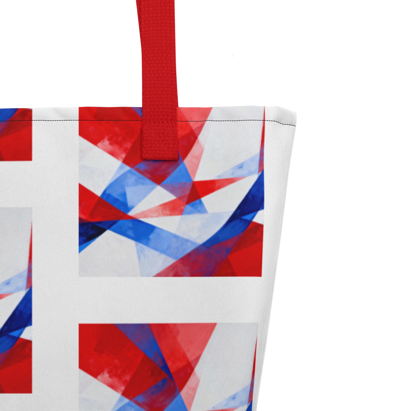 Beach tote bag close-up of white, red, and blue geometric block print with red handle