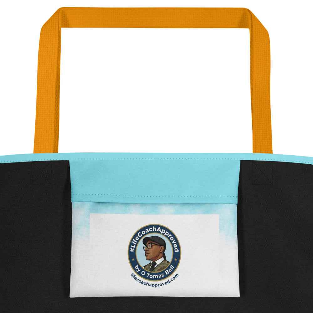 Two-tone beach tote bag with circular logo patch, orange handles, black and blue panels