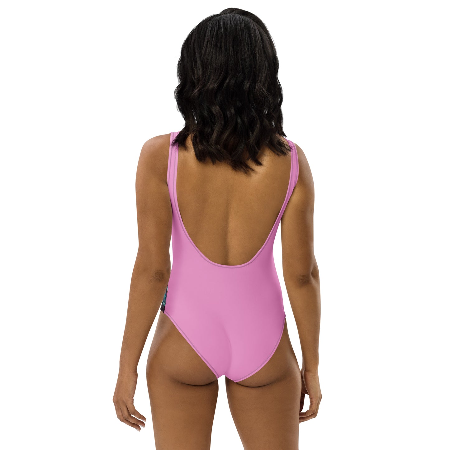 Back view of solid pink one-piece swimsuit with purple straps and deep scoop back.