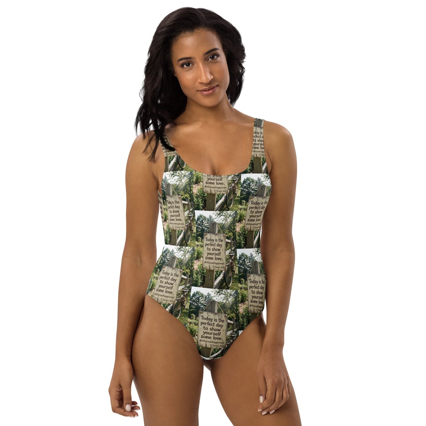 Front view of green and white photo-printed one-piece swimsuit with high-leg cut