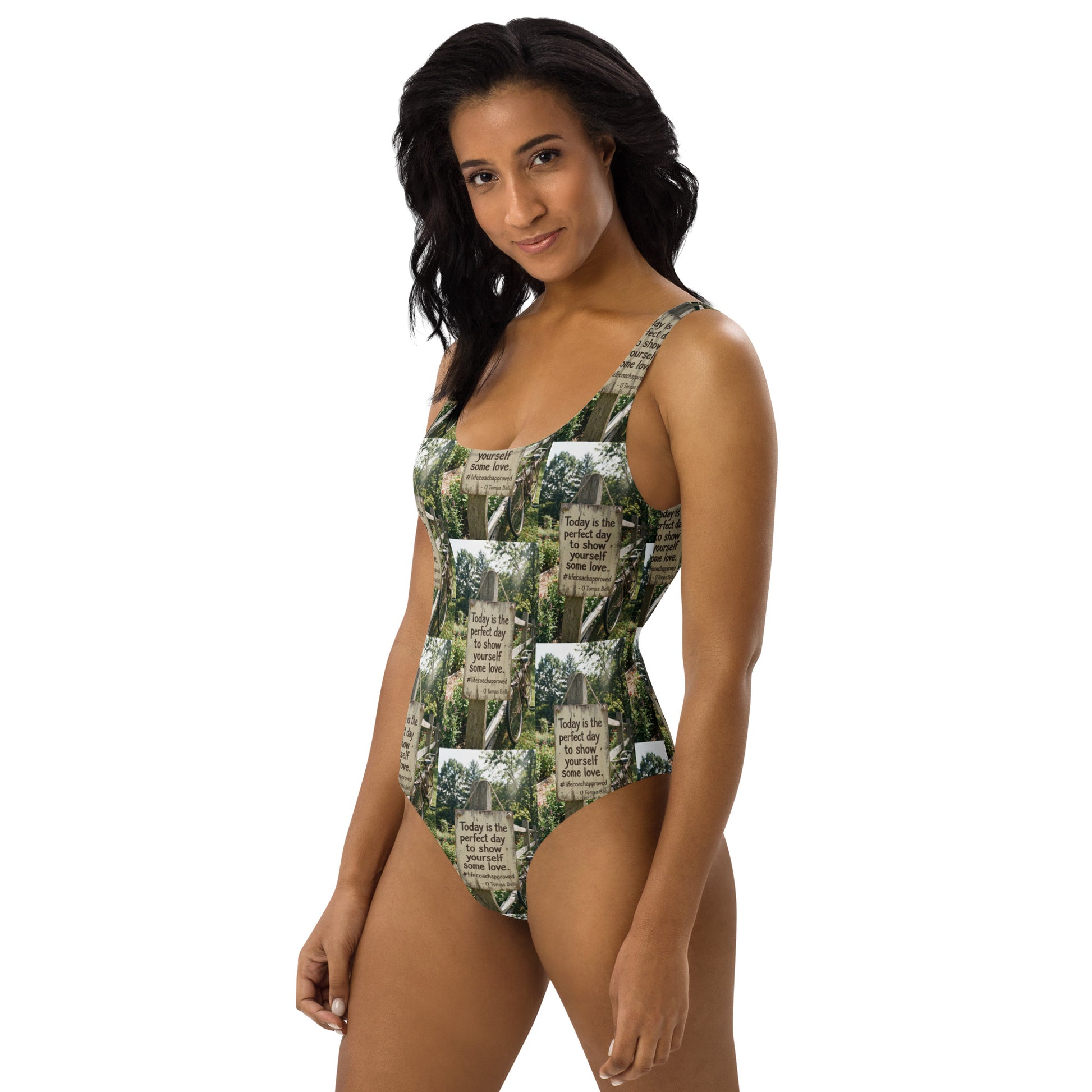 Front view of green and white photo-printed one-piece swimsuit, scoop neckline and straps