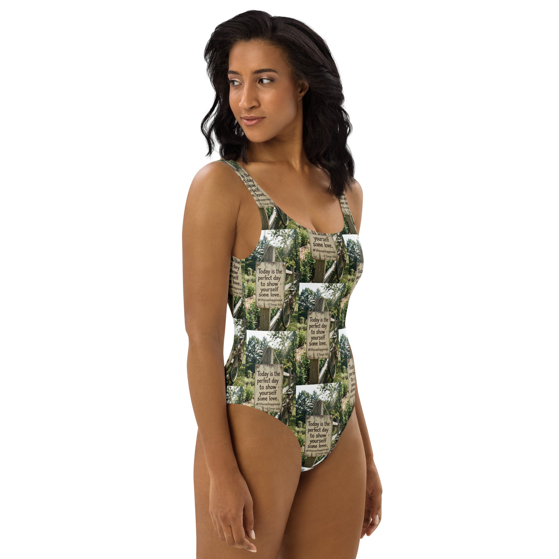 Front view of green and white printed one-piece swimsuit with scoop neckline and straps