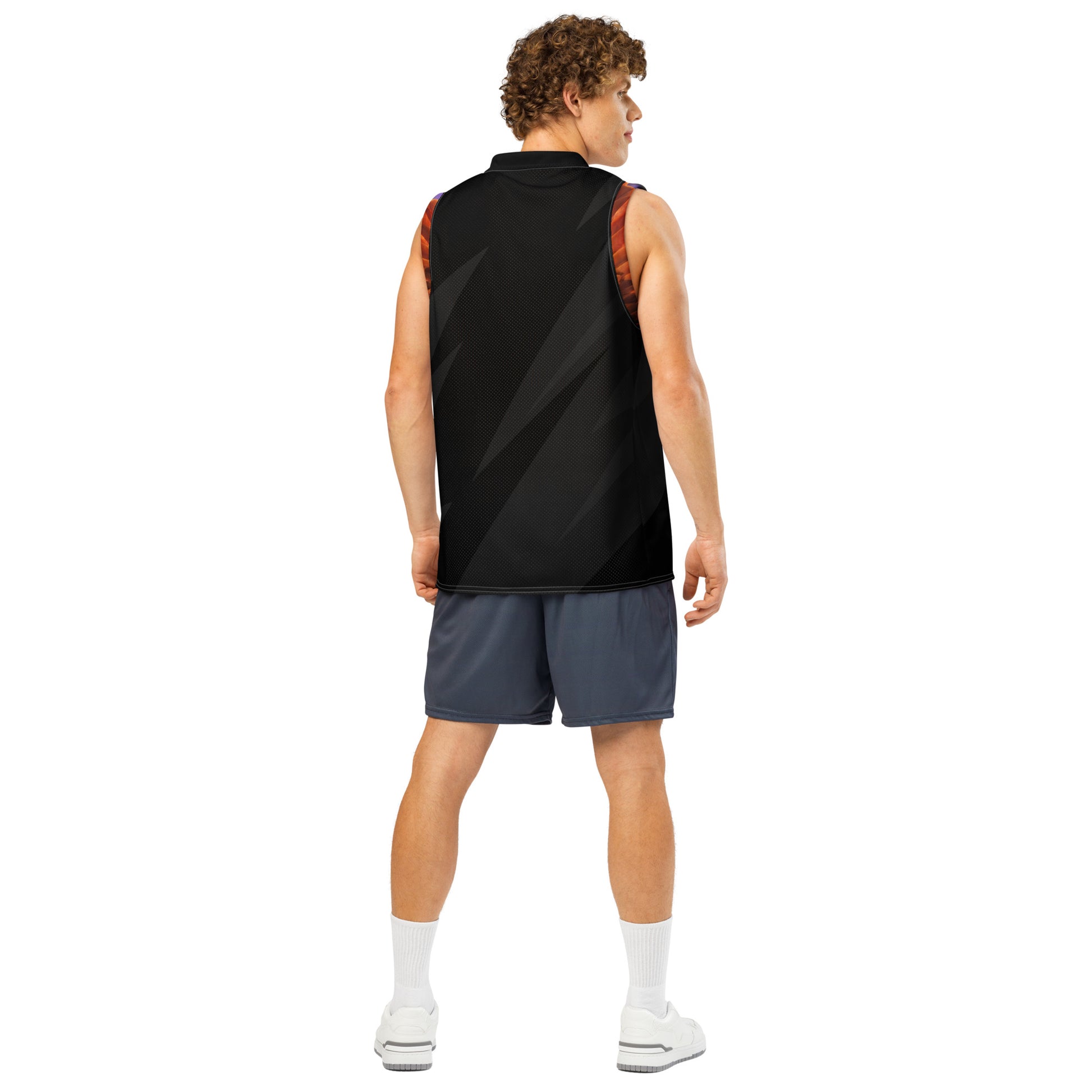 Basketball jersey back on model, black mesh with diagonal pattern and orange-trim arm openings.