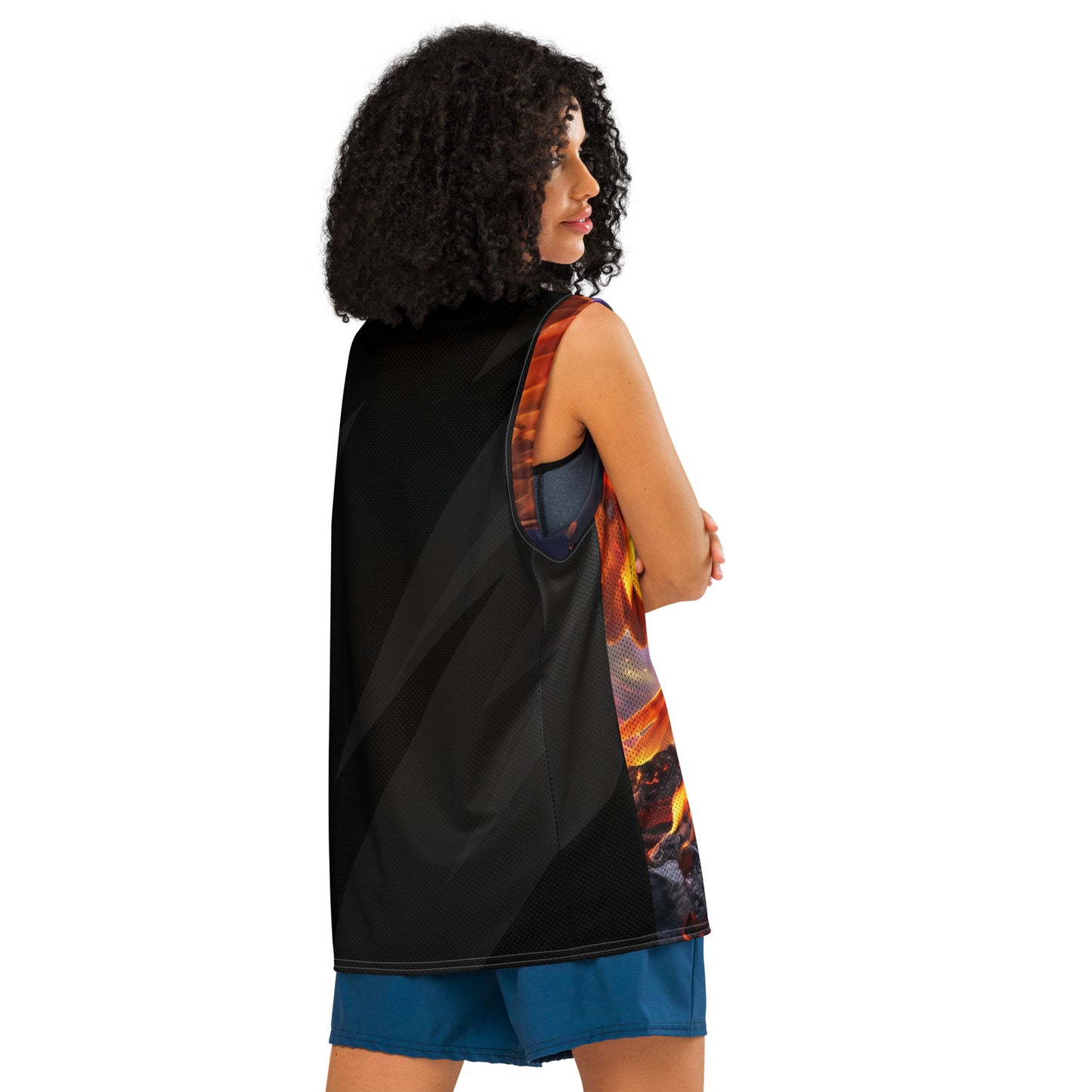 Model side view of basketball jersey, black mesh back with diagonal pattern and flame edge print.