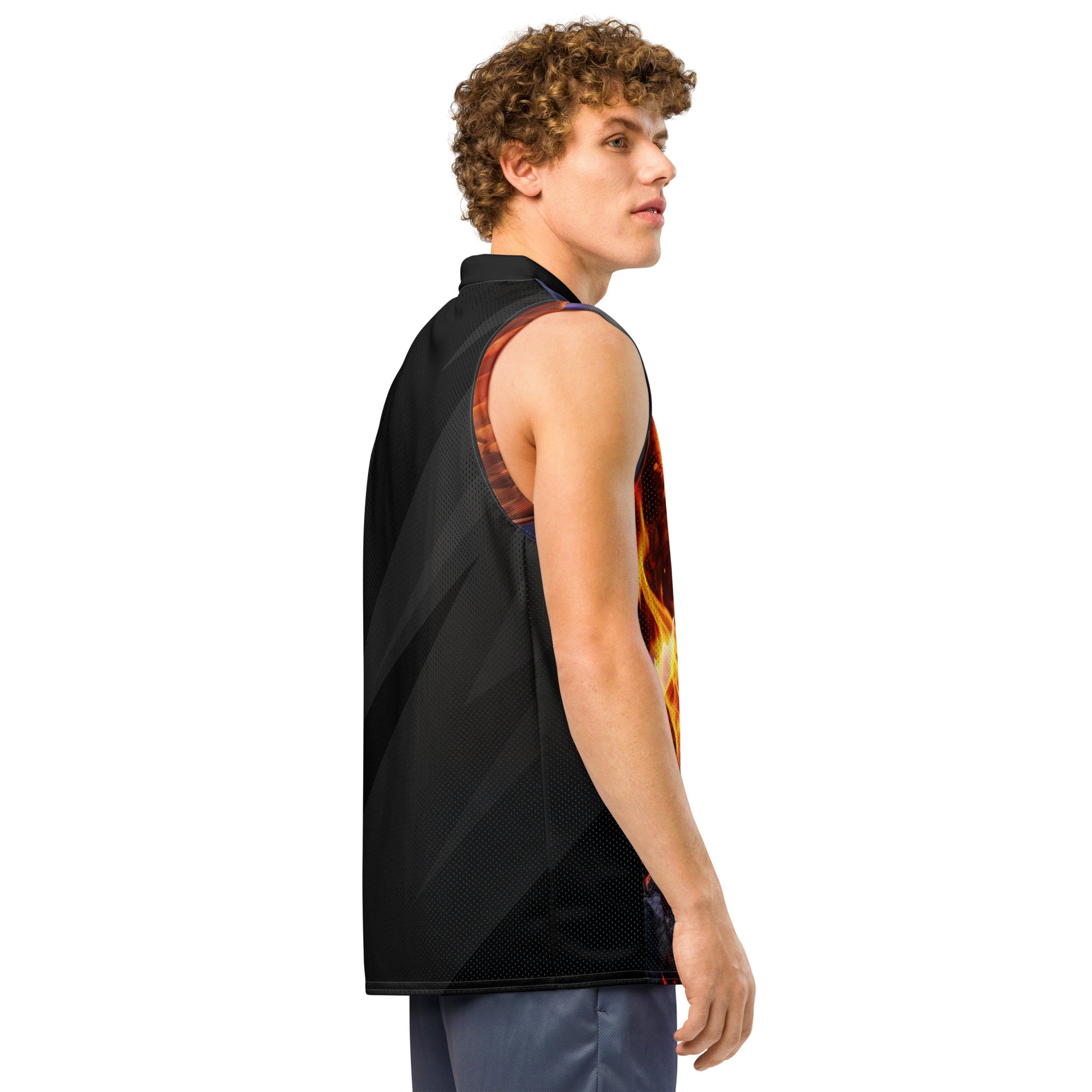 Model side view of basketball jersey, black mesh back panel with orange shoulder accents.