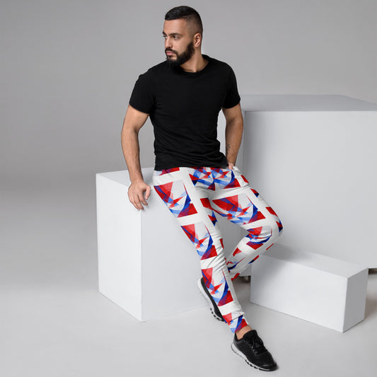 Men's jogger pants with white base and red/blue geometric flag print, cuffed ankles.