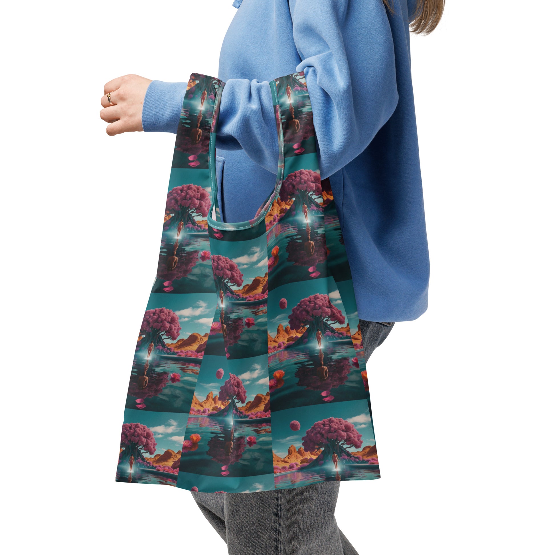 Shopping bag with teal trim and repeating fantasy scene print in teal, pink, and orange