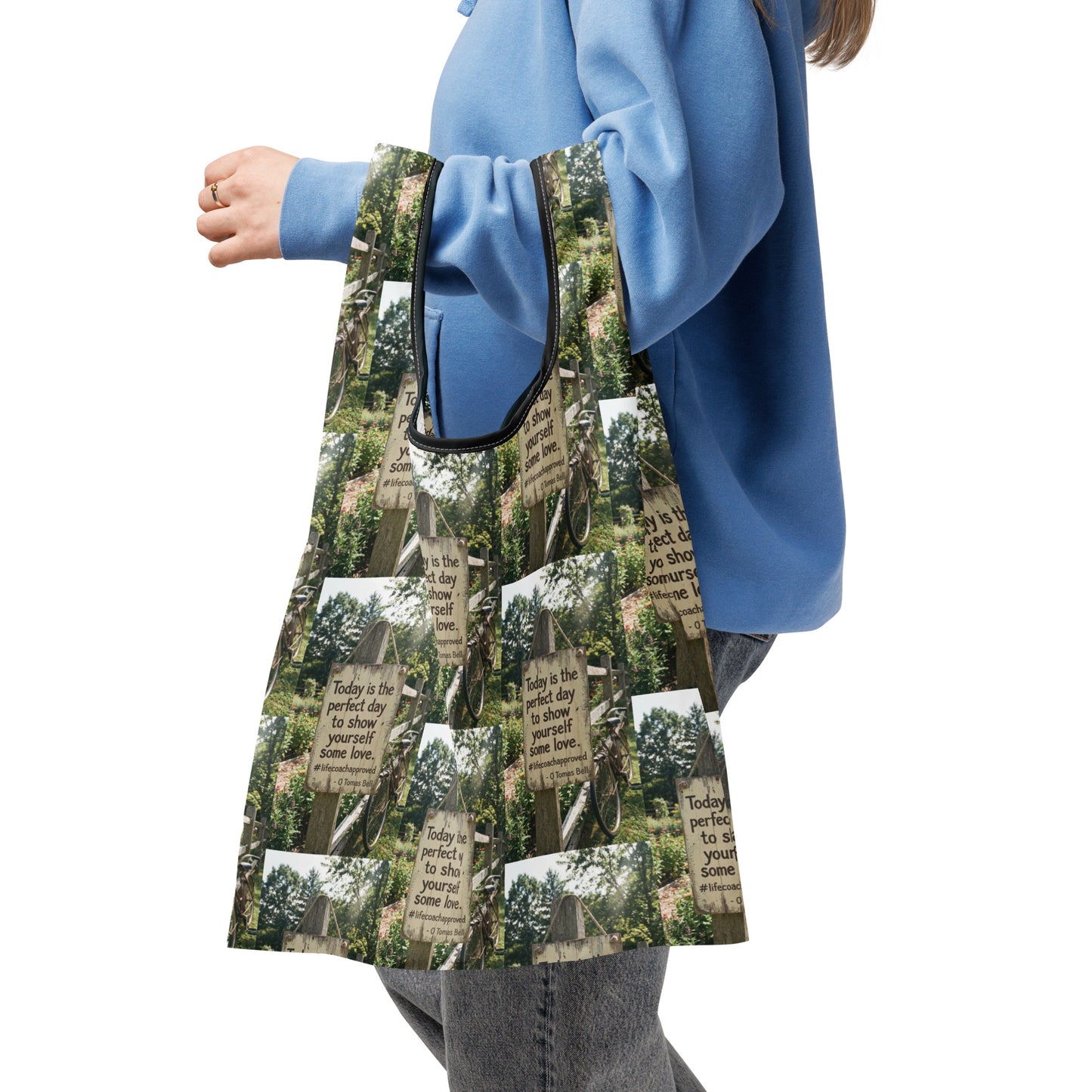 Self Love shopping bag with forest sign print and black zip-style trim, side view
