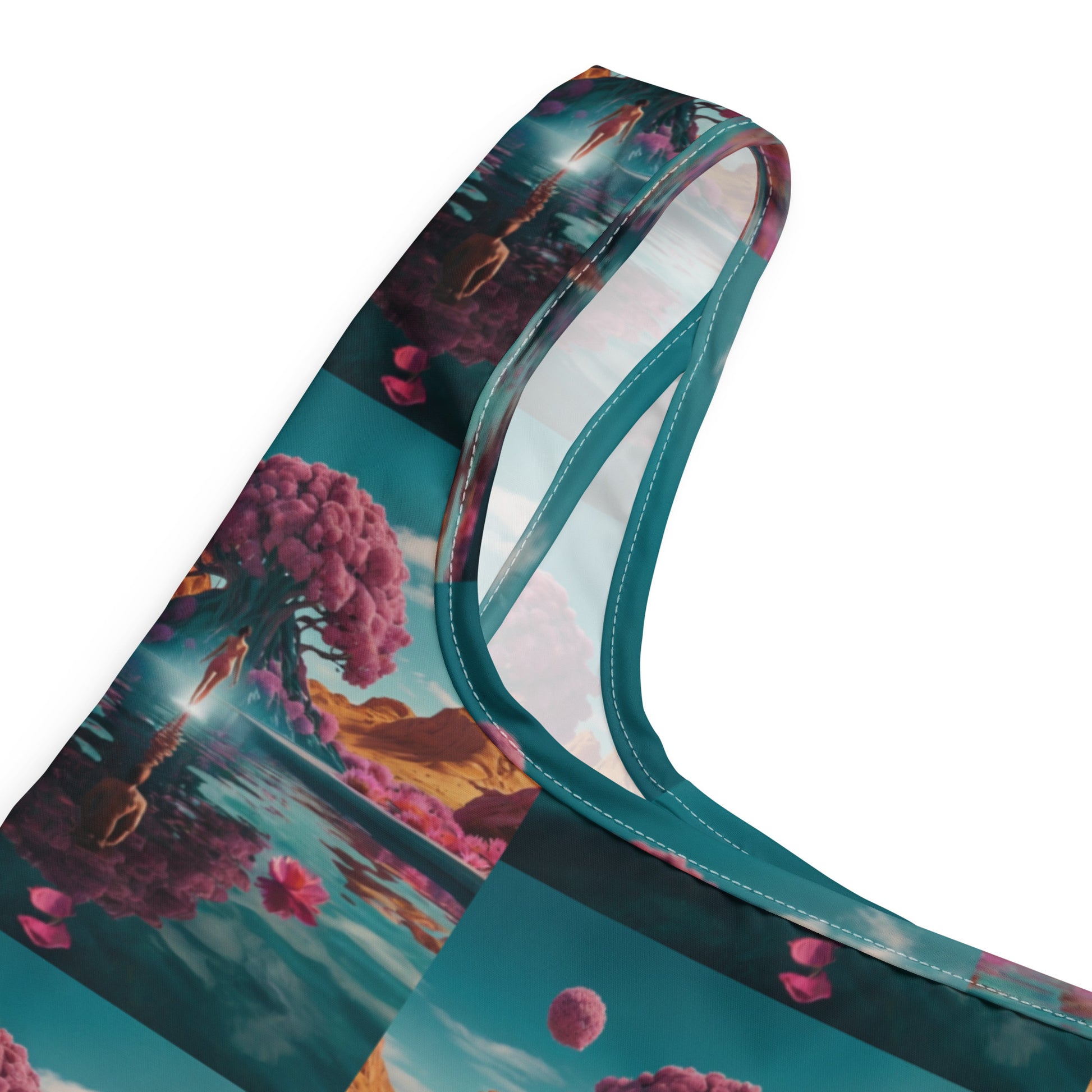 Printed bag strap and side panel close-up with teal trim; multicolor fantasy landscape graphic.