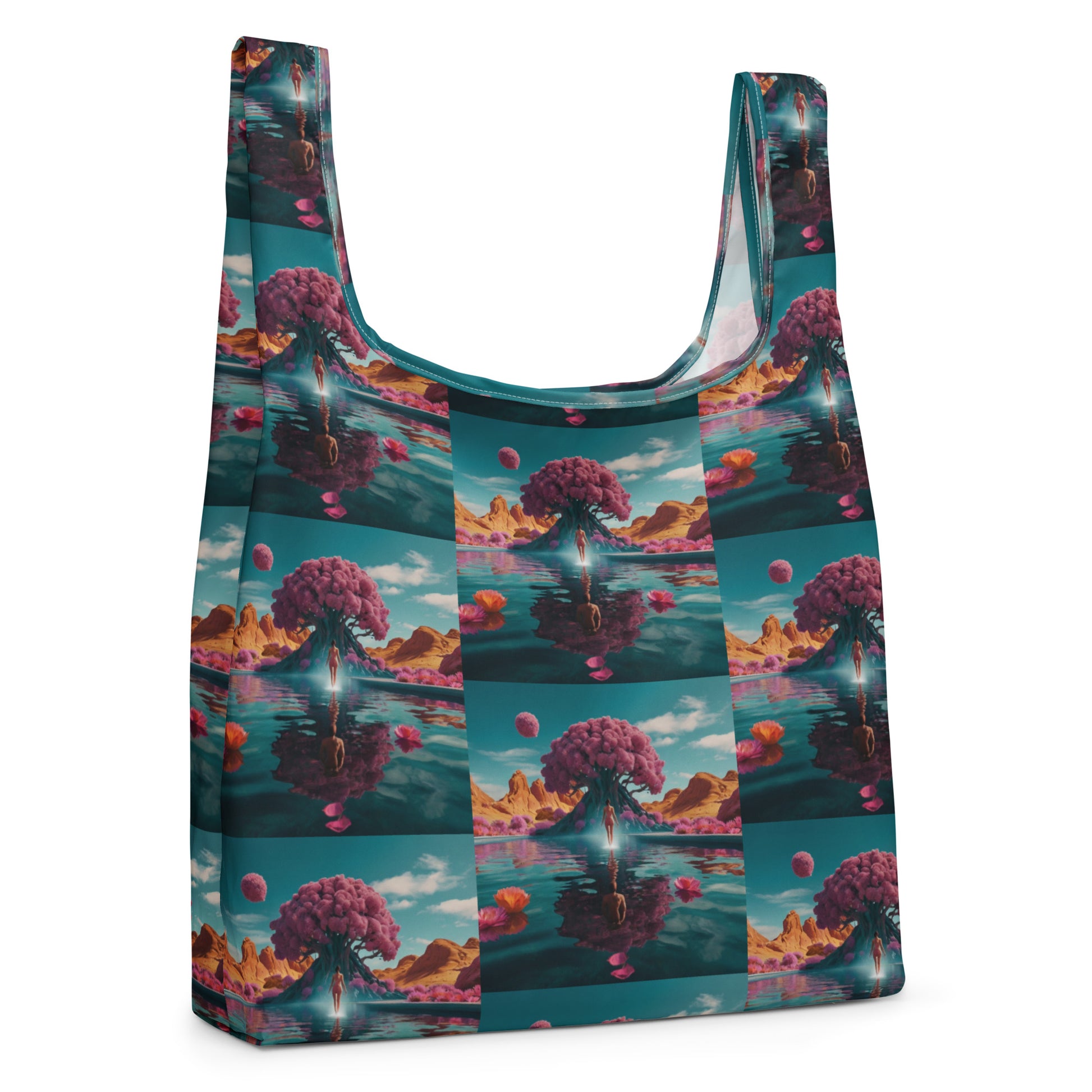 Printed tote bag with teal trim; front-facing view with wide U handles and fantasy landscape pattern.